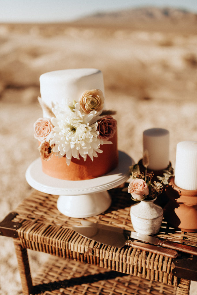 cake with floral on wicker table