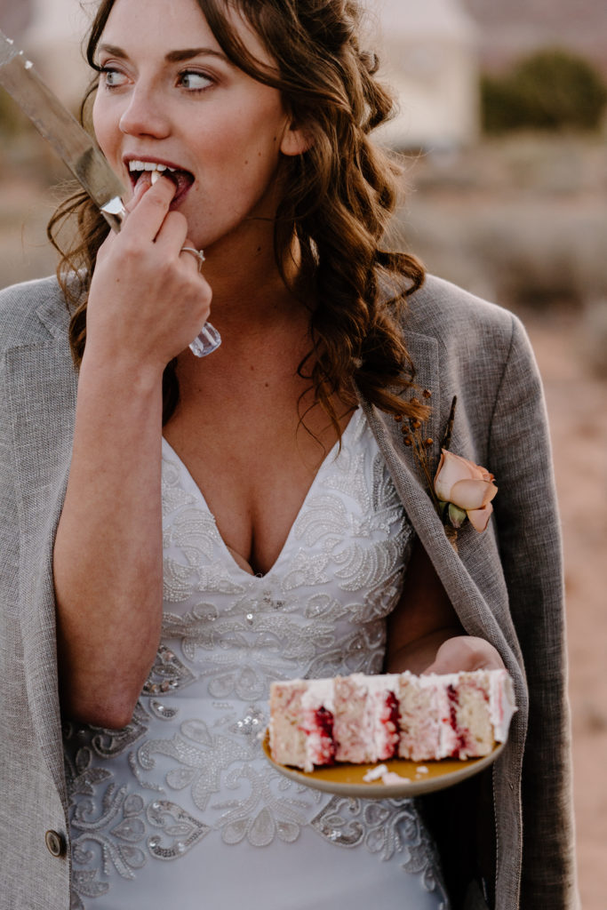 Bride enjoying cake after adventure  elopement ceremony 
