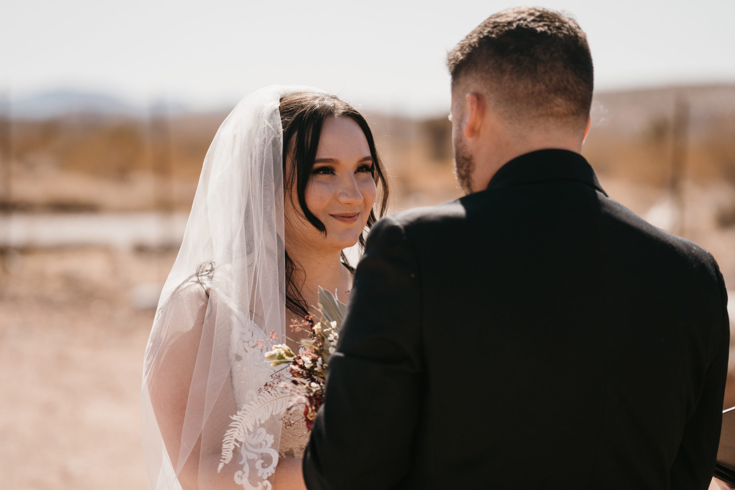 Couple looking at each other during ceremony 