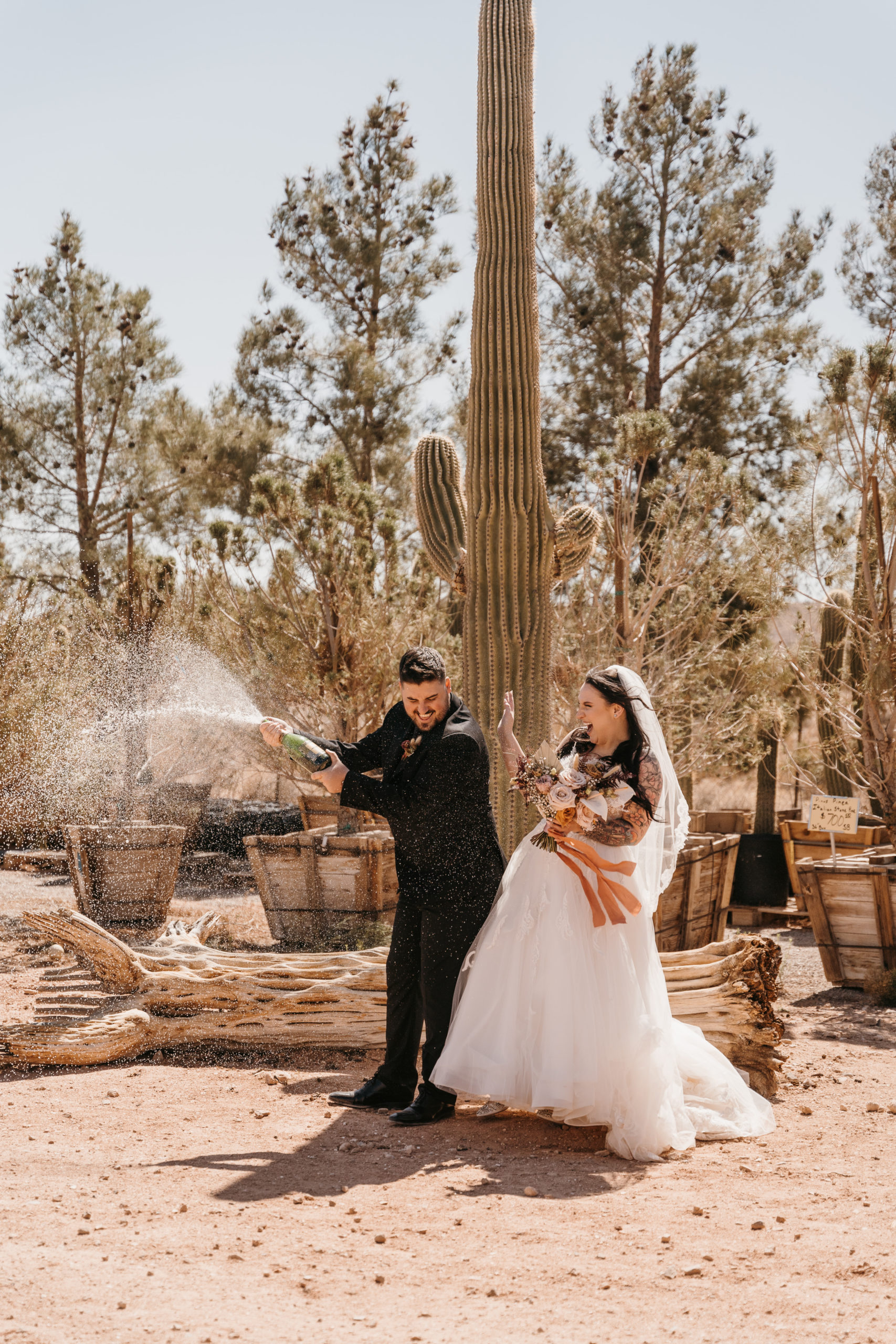 Champagne spray for newly wedded couple in Las Vegas desert 