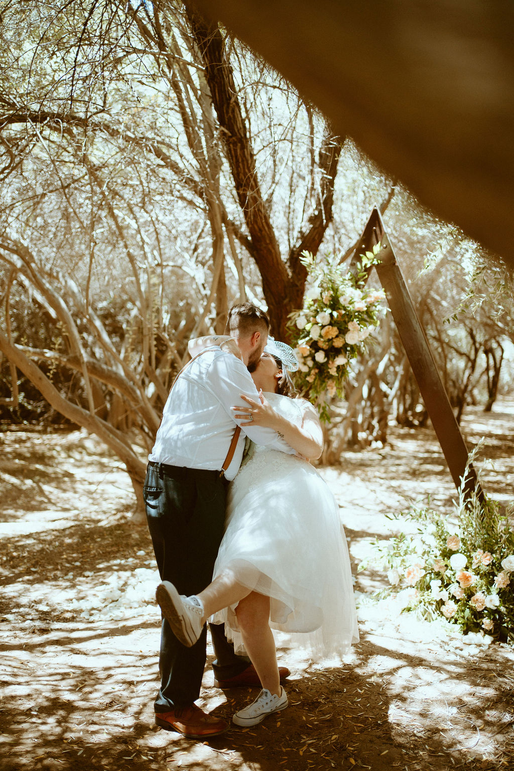 Couple having first dance in olive grove 