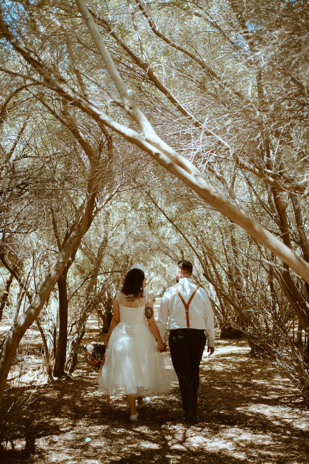 Bride and Groom walking away back towards camera Elopement Photography 