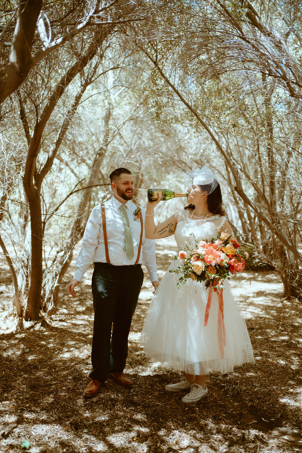 Bride drinking champagne out of bottle in Las Vegas 