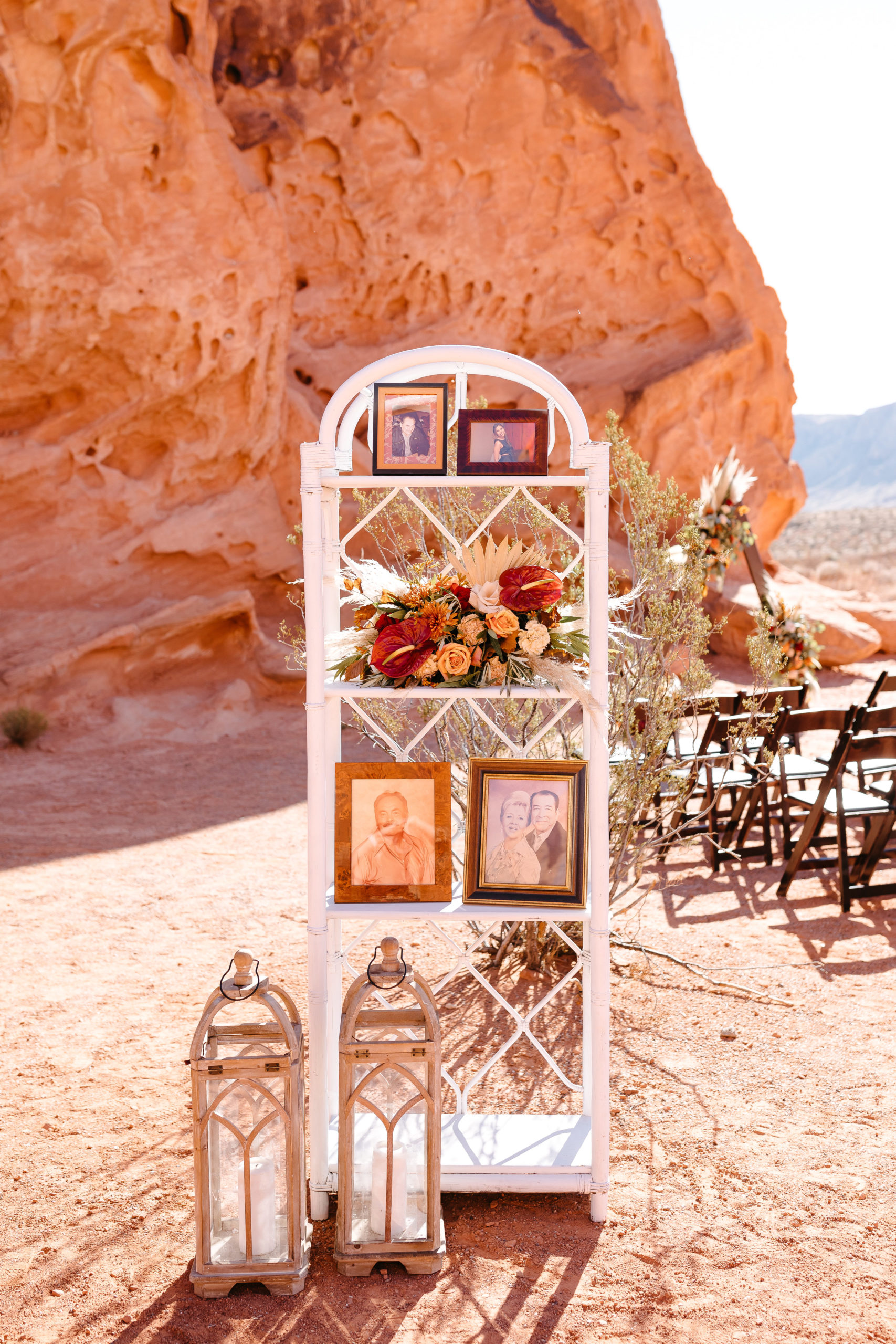 memory table with photos to remember loved ones who are not able to be there on their wedding day 