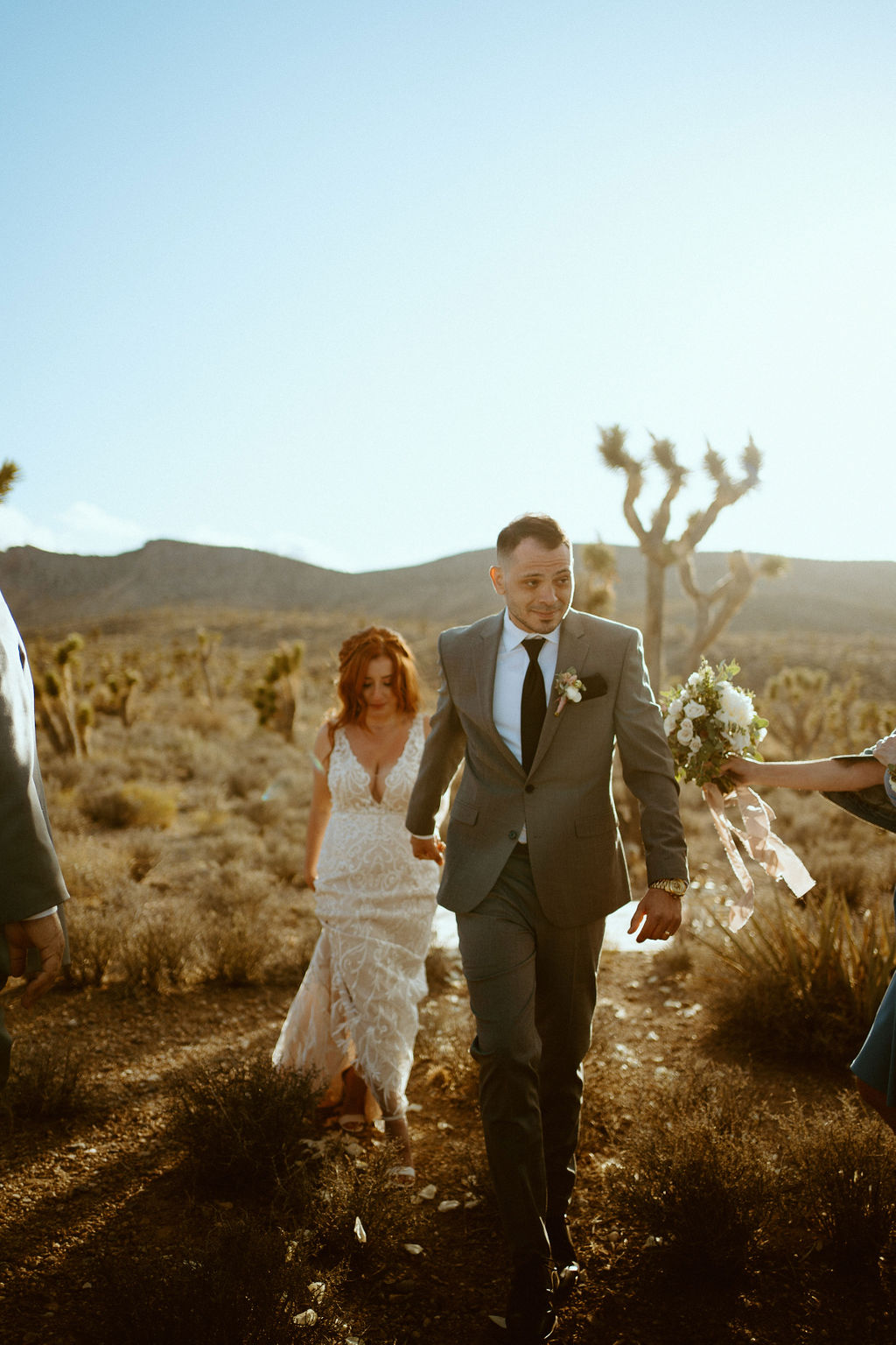 Newlyweds exiting ceremony of Kyle Canyon Timeless Desert Elopement