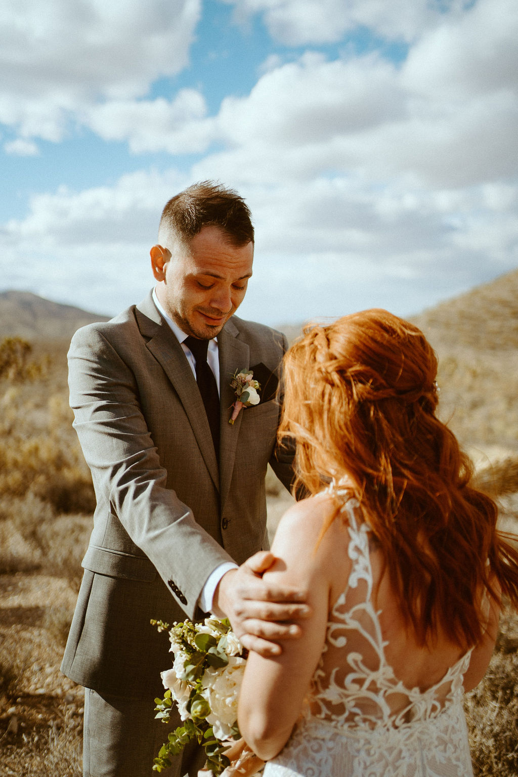 man emotional seeing his wife to be in Kyle Canyon Timeless Desert Elopement just outside of Las Vegas 