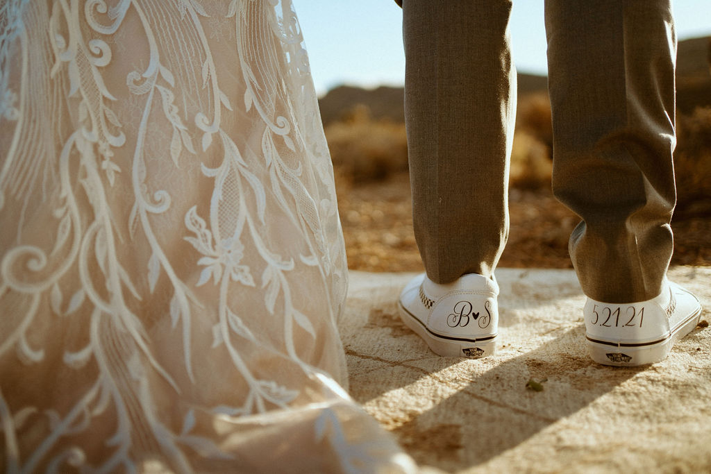 back of brides dress and back of groom shoe which has wedding date on them for their Kyle Canyon Timeless Desert Elopement