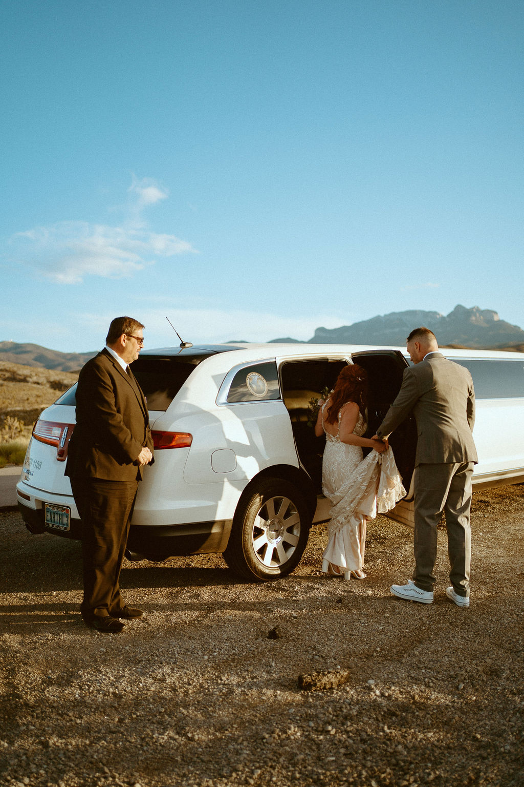 Getting in limo after their Kyle Canyon Timeless Desert Elopement