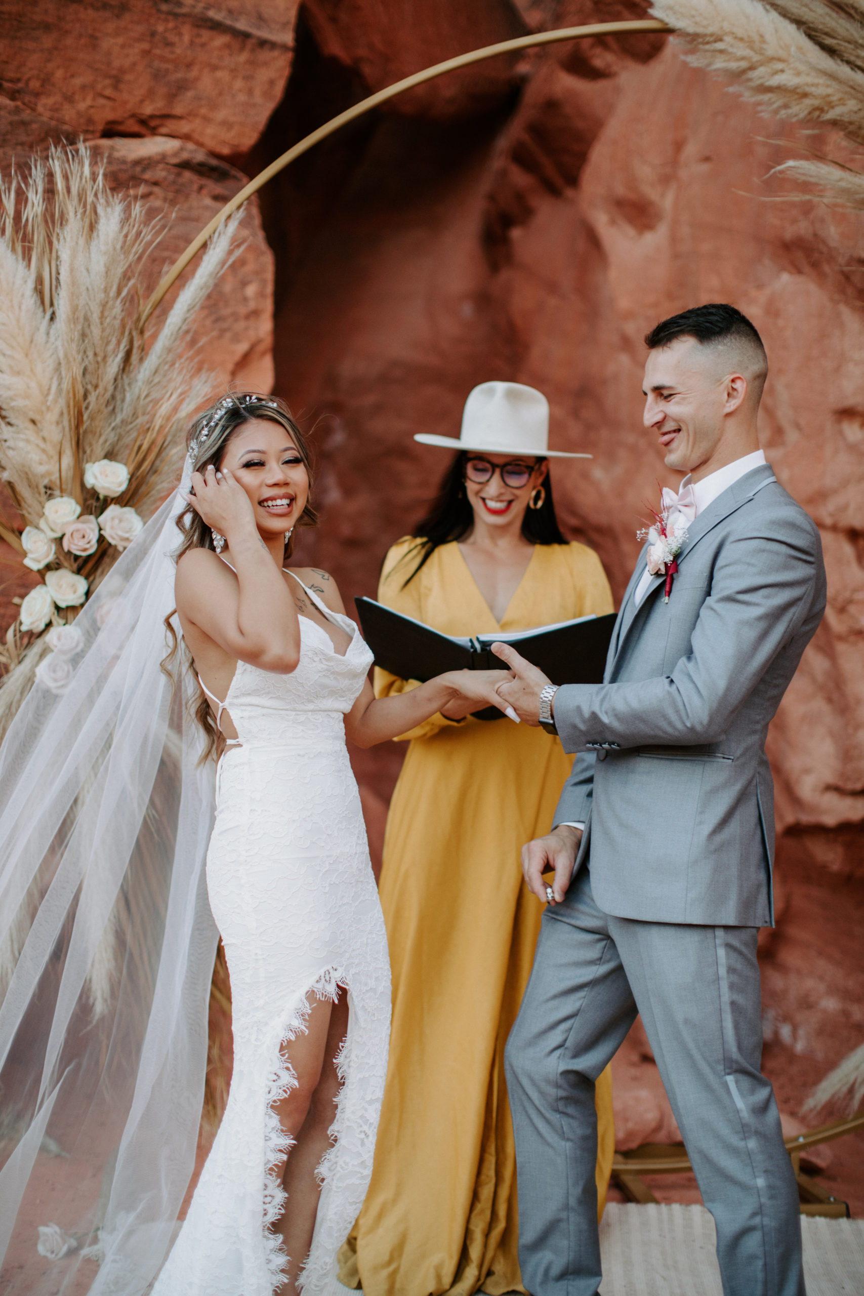 Bride and Groom laughing during Boho Pampas Desert Elopement ceremony 