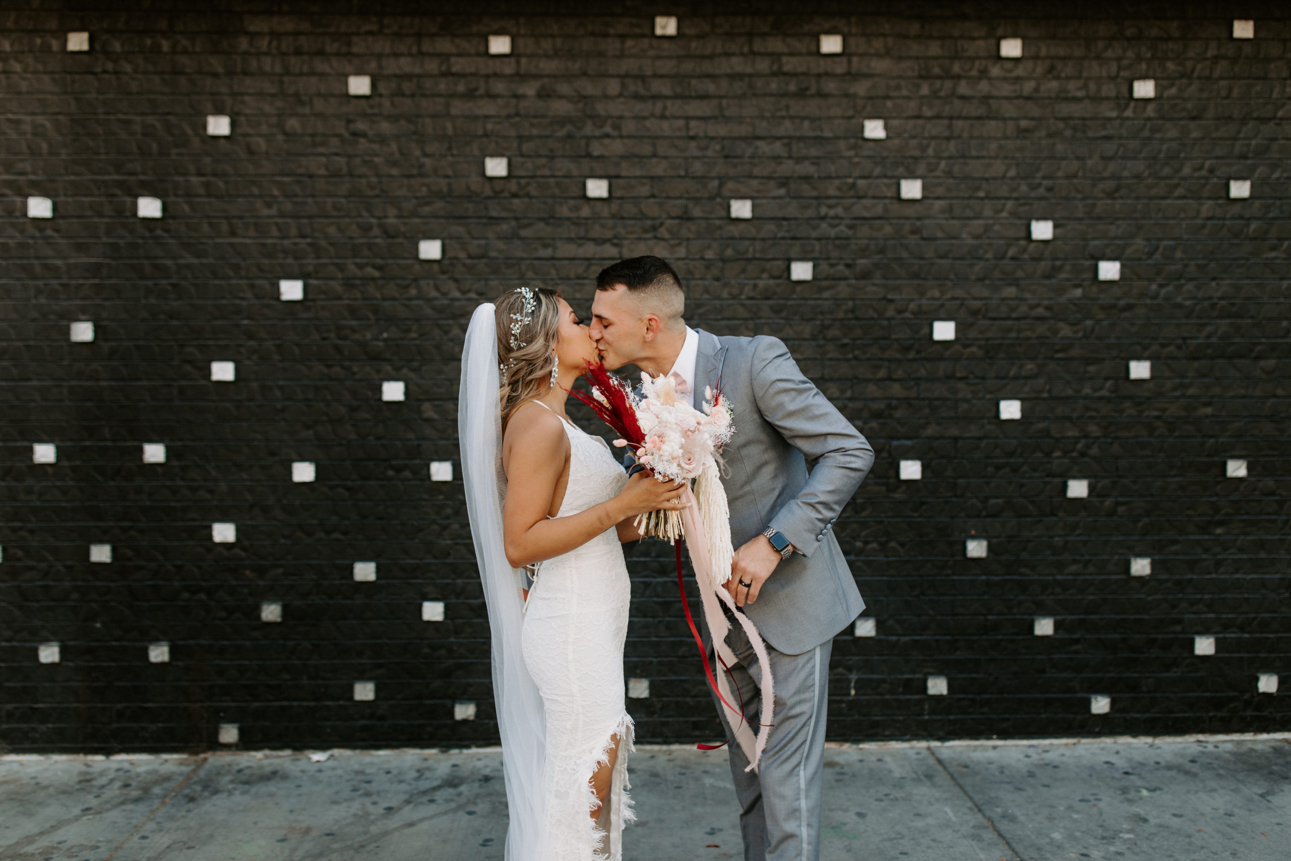 Bride and Groom kissing during first look in downtown Las Vegas 