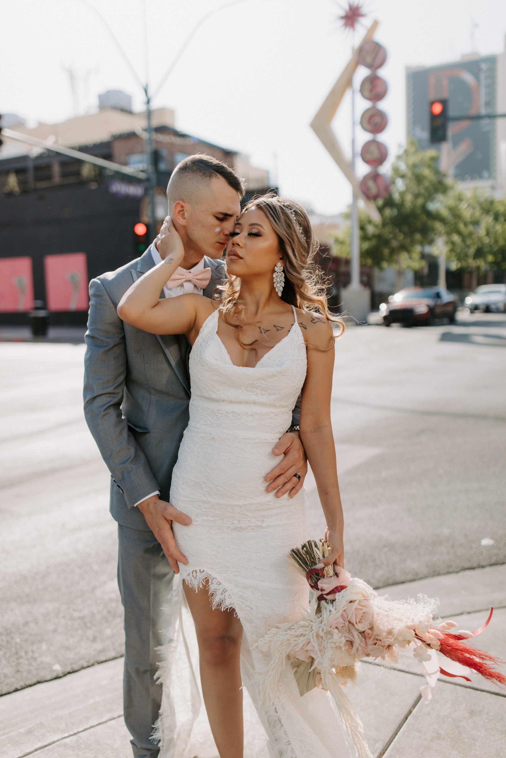 Bride and Groom posing for photos in Downtown Las Vegas prior to eloping 