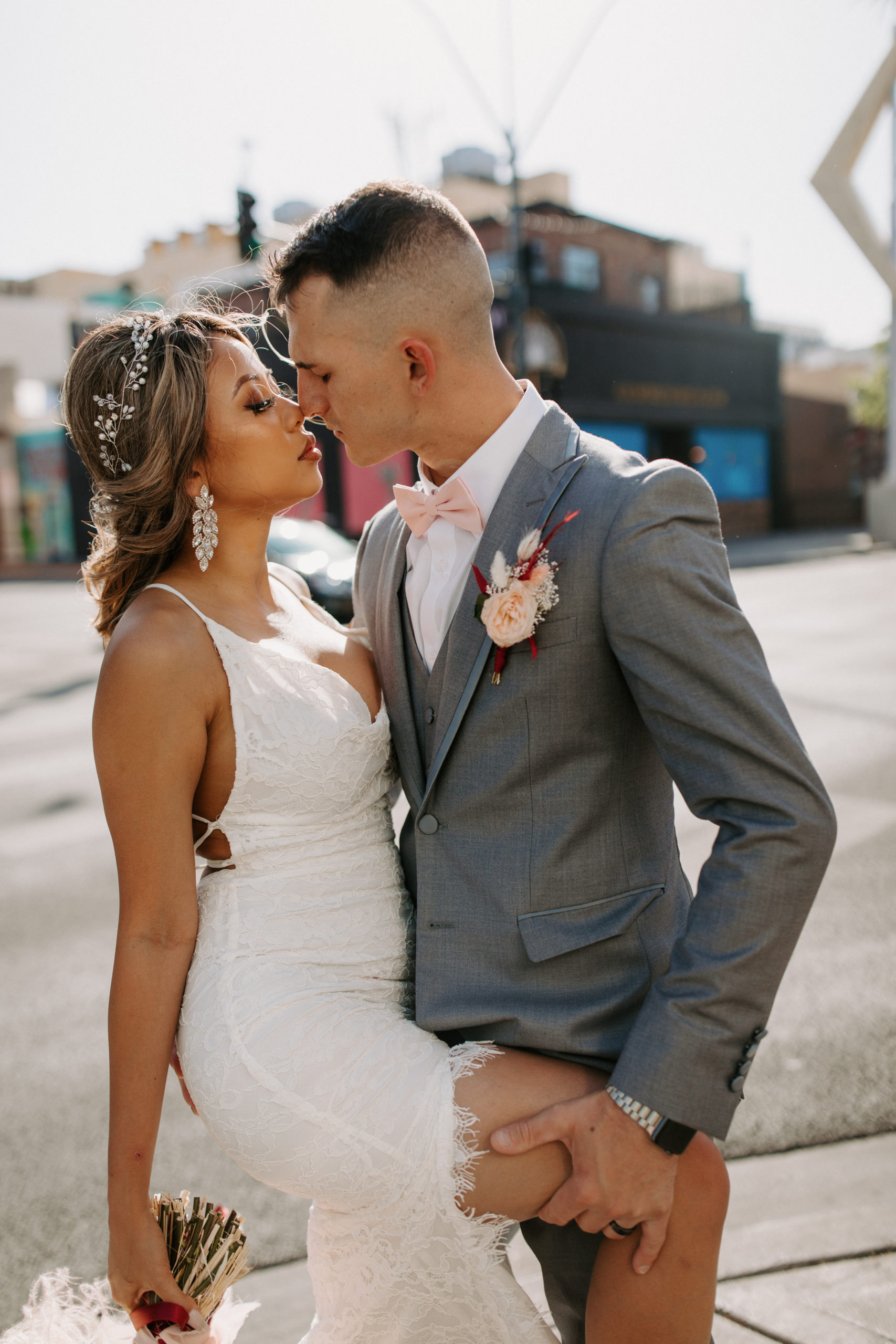 Couple posing for photos in Downtown Las Vegas prior to eloping 