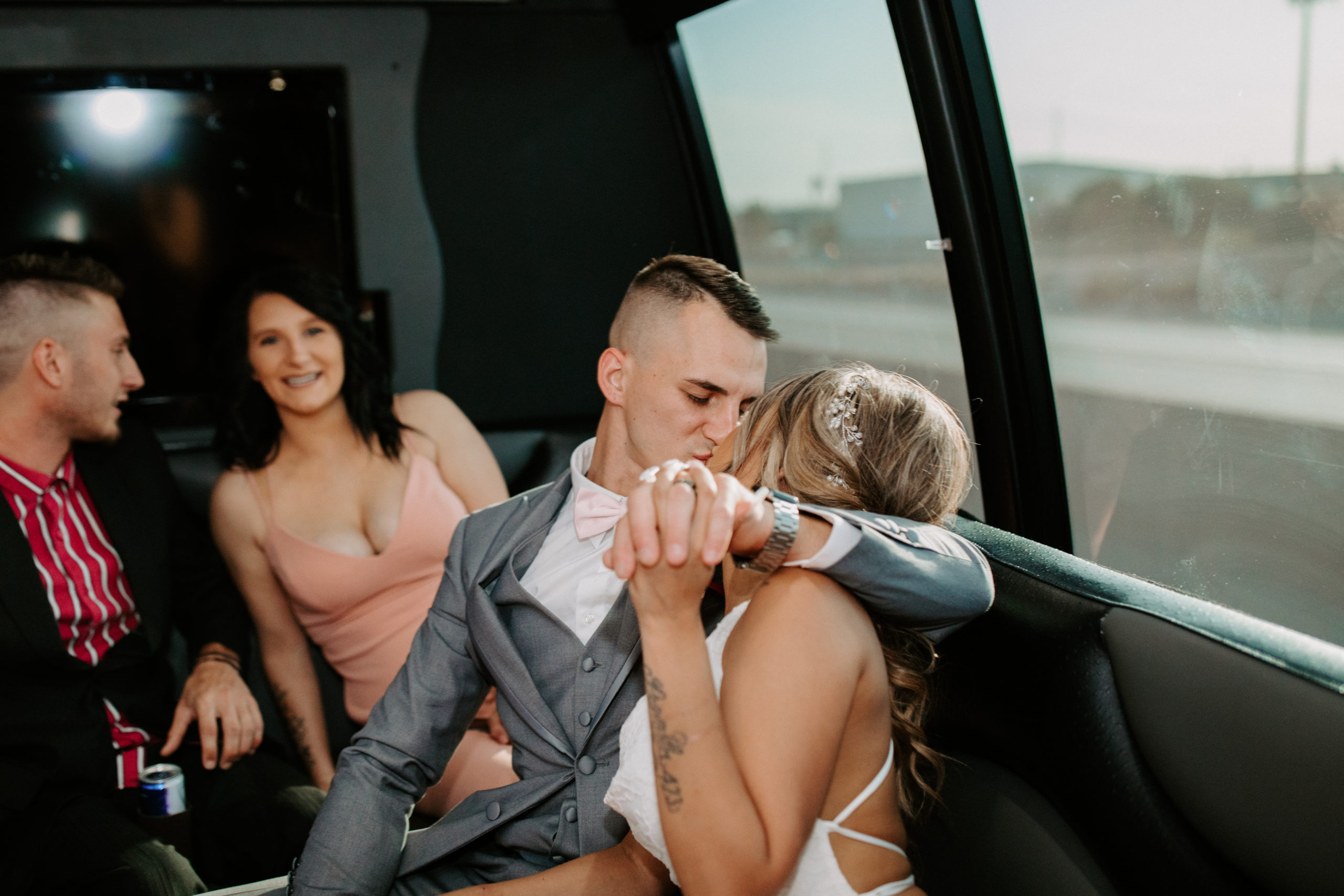 Bride and Groom Kissing on the Party Bus 