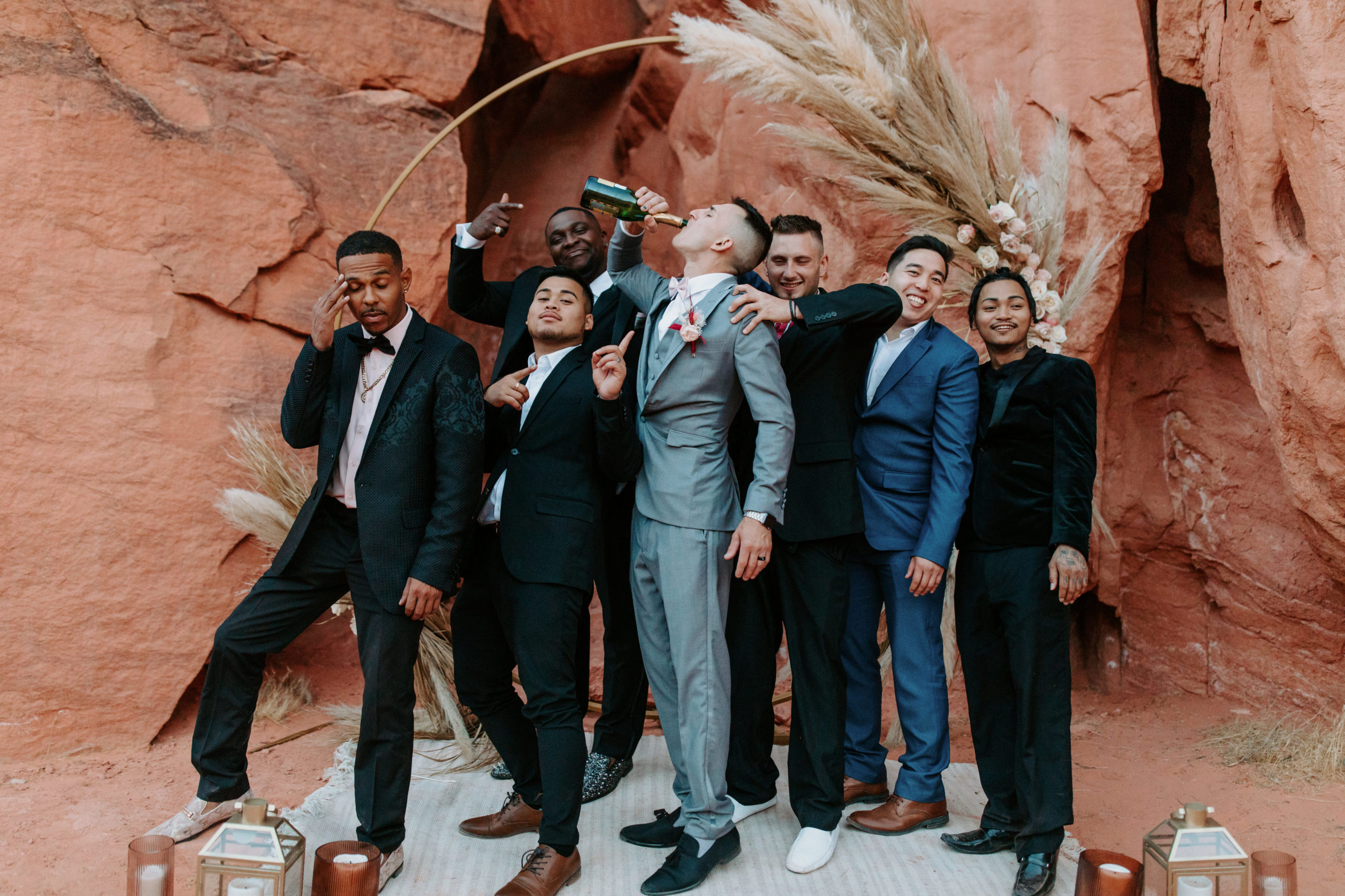 Groom celebrating with his guests during Boho Pampas Desert Elopement