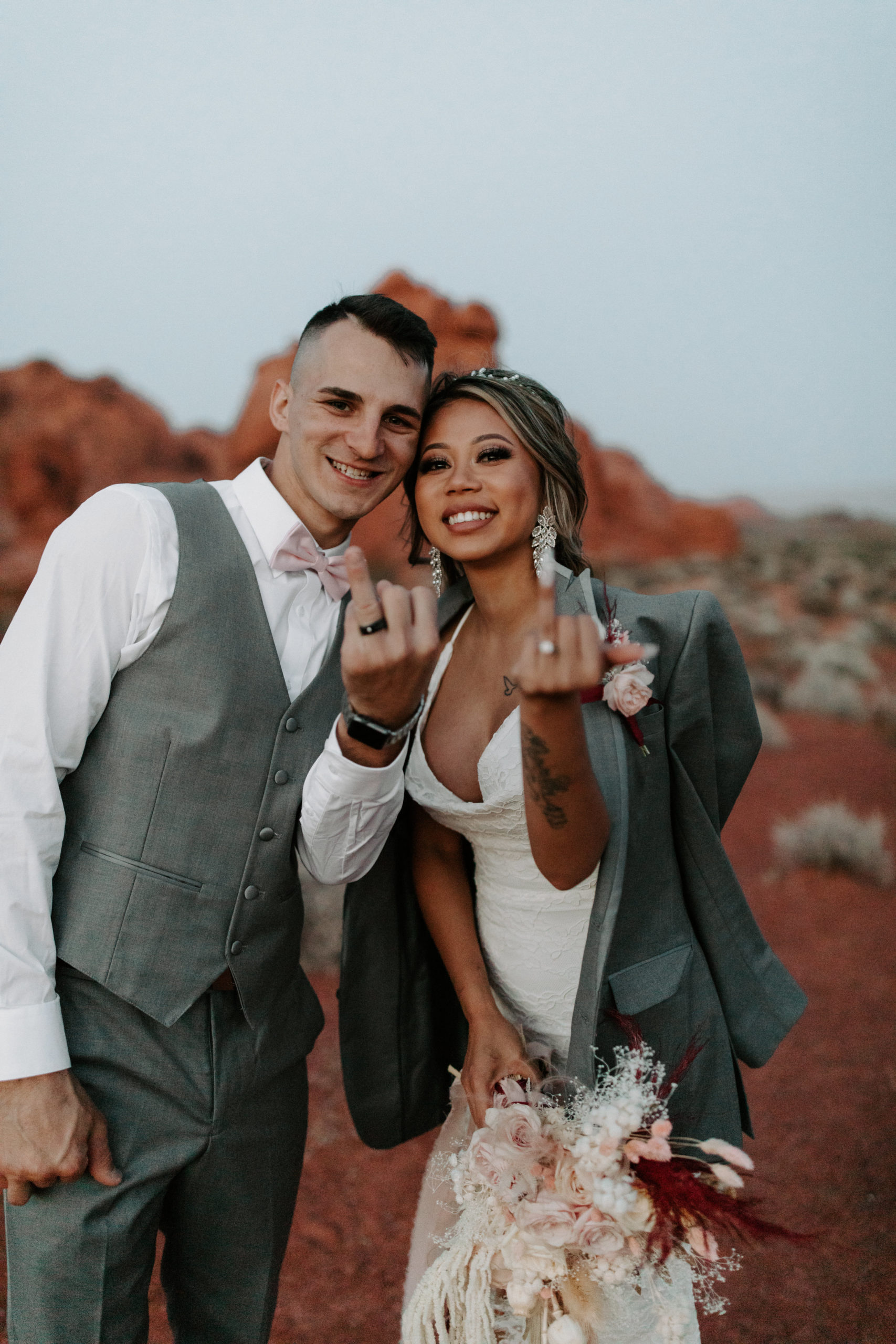 Bride and Groom flipping camera off after eloping just outside of Las Vegas 