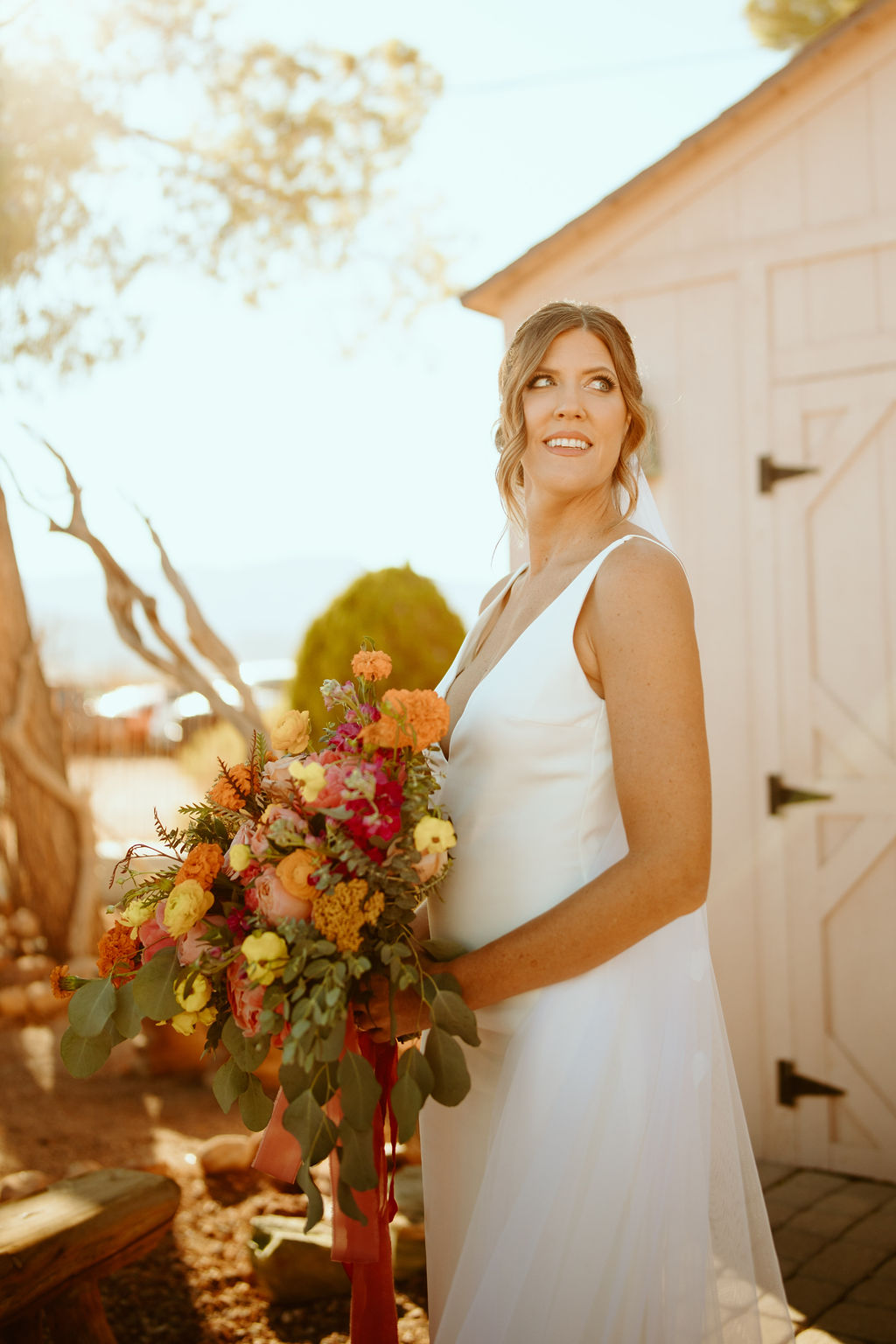 Bright & Bold Sunset Desert Wedding Bride in white wedding gown 