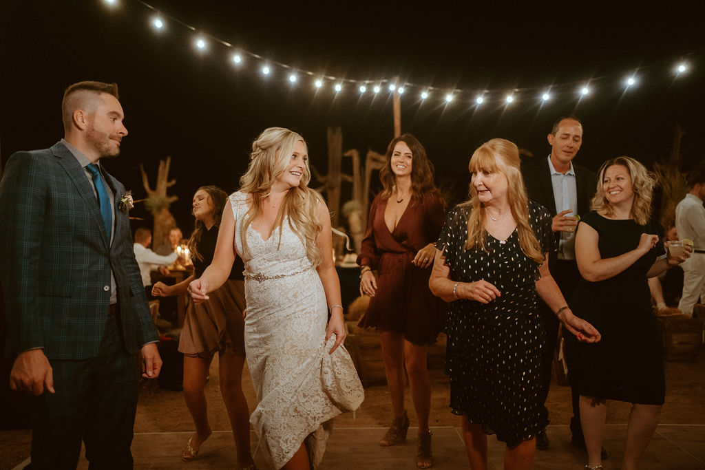 Guests Dancing with Newlyweds in Las Vegas Wedding Reception in Desert Outside 