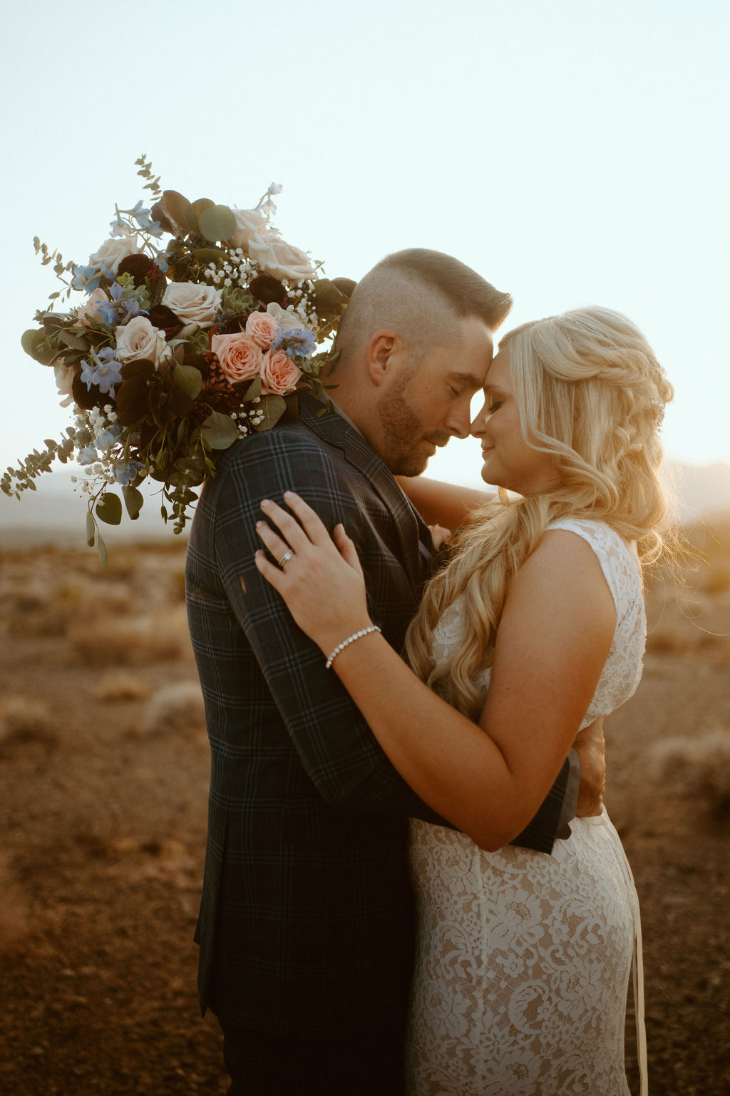 Groom and Bride Touching Noses in Desert during Sunset in Las Vegas 