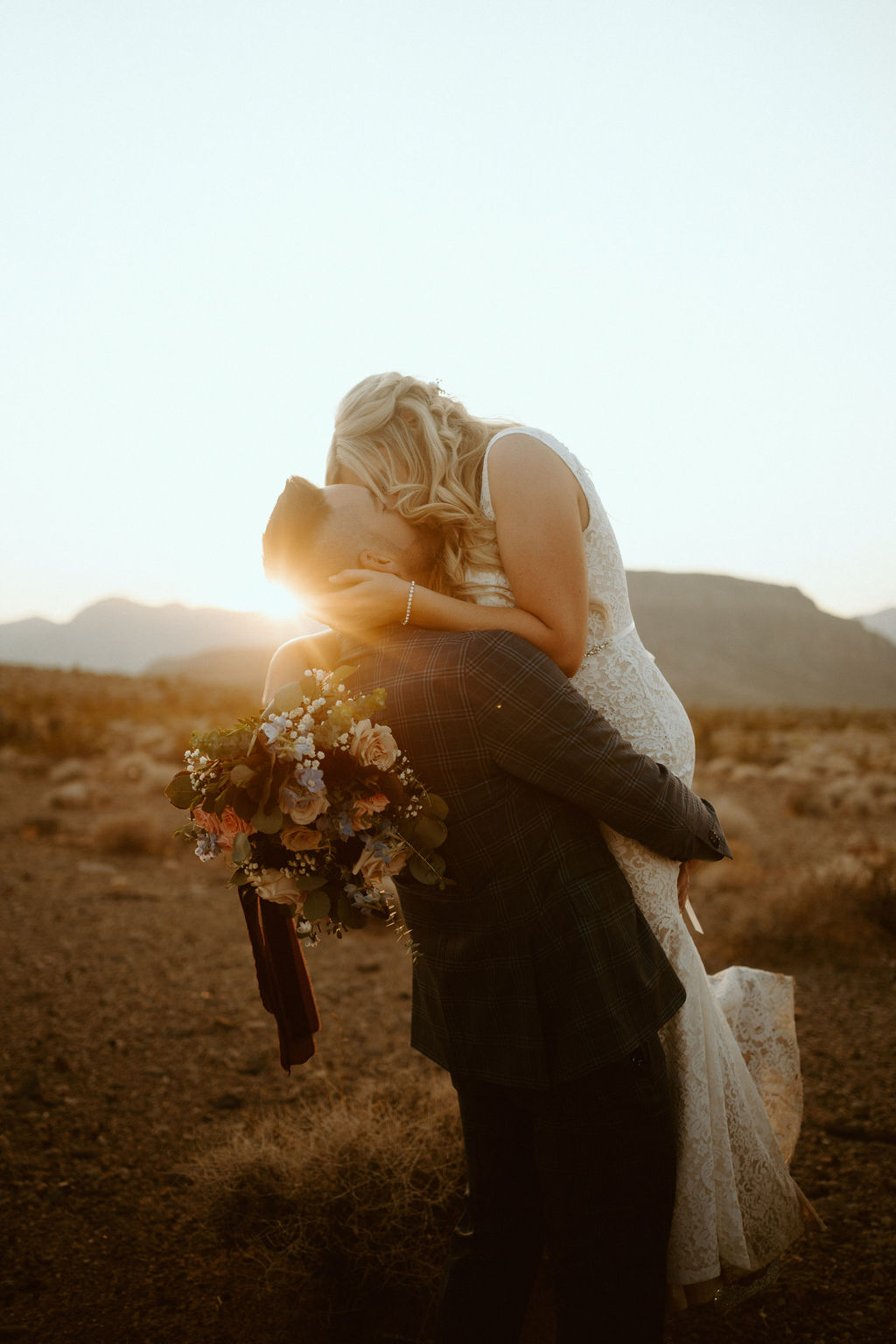 Newlyweds Kissing as Sun Sets at Cactus Joe's Micro-Wedding