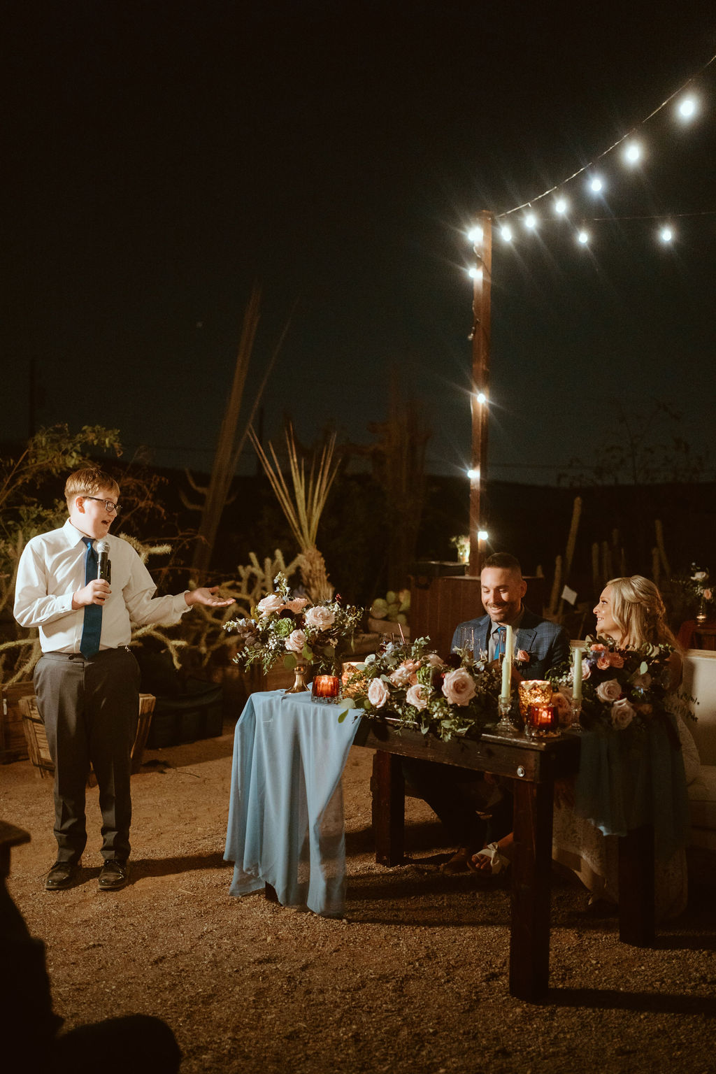 Boy Giving Speech During Outdoor Wedding Reception 