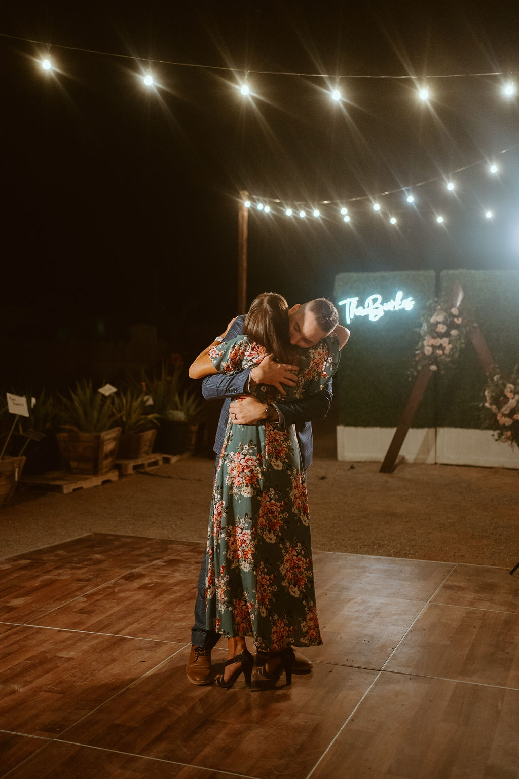 Groom Hugging Mom after Groom-Mother Dance at Wedding Reception 