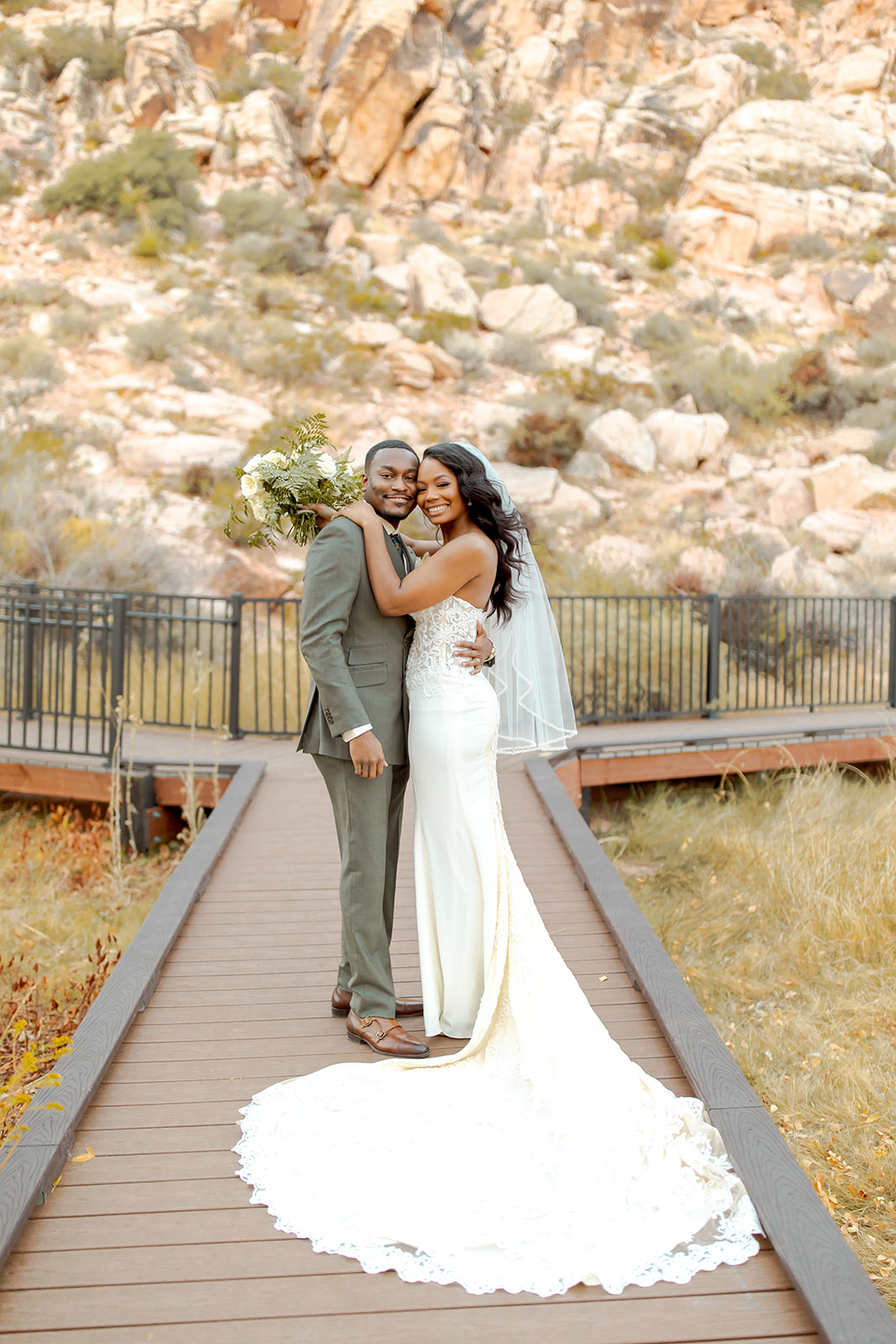 Newlyweds smiling after getting married in Red Rock Canyon 