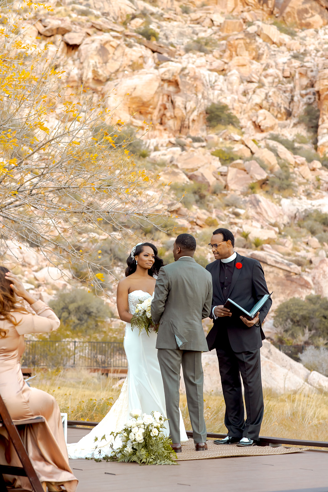 Bride and groom with dramatic rocks in the back at Red Rock Canyon
