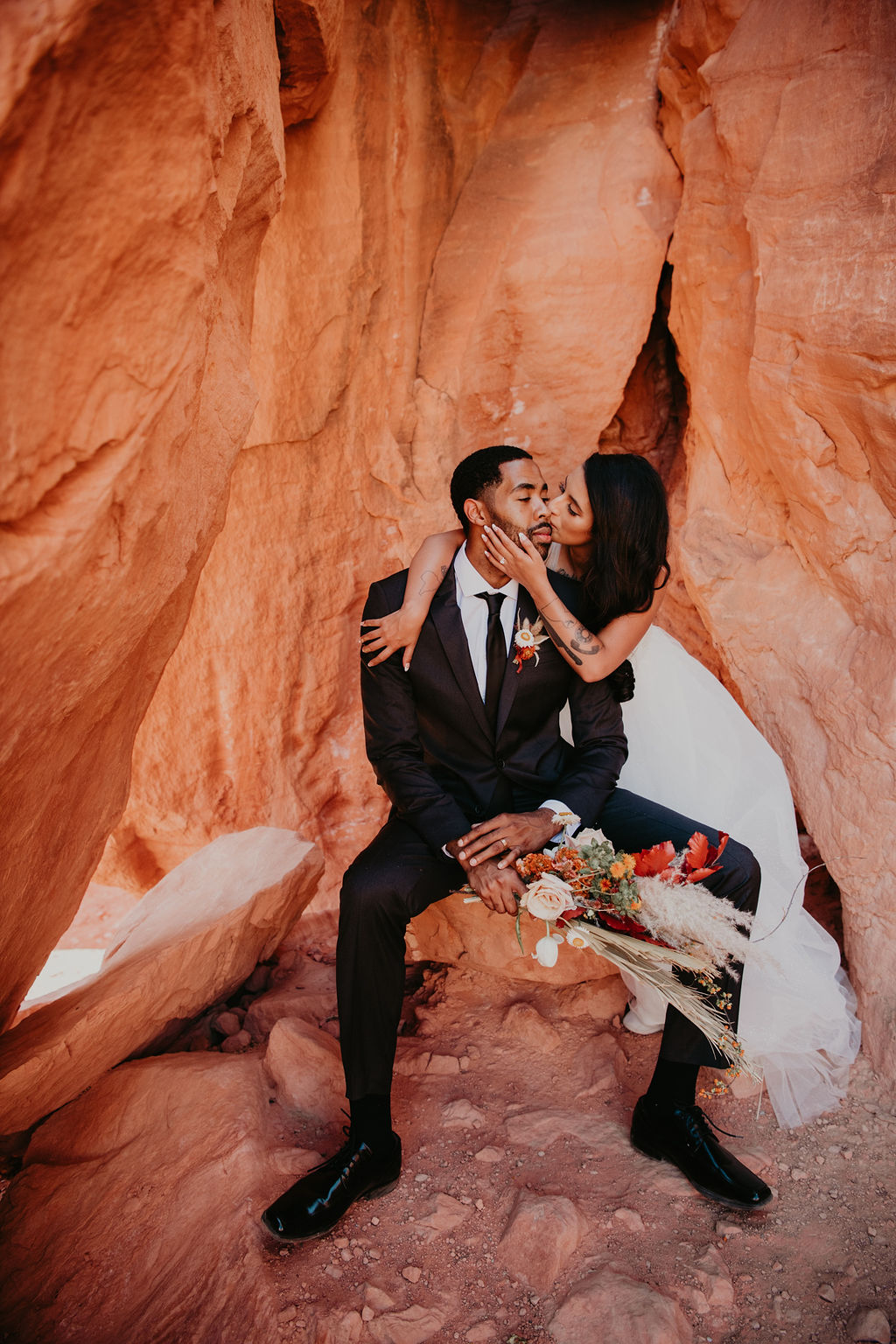 Bride Kissing Groom at Valley of Fire in Off the Strip Las Vegas Wedding