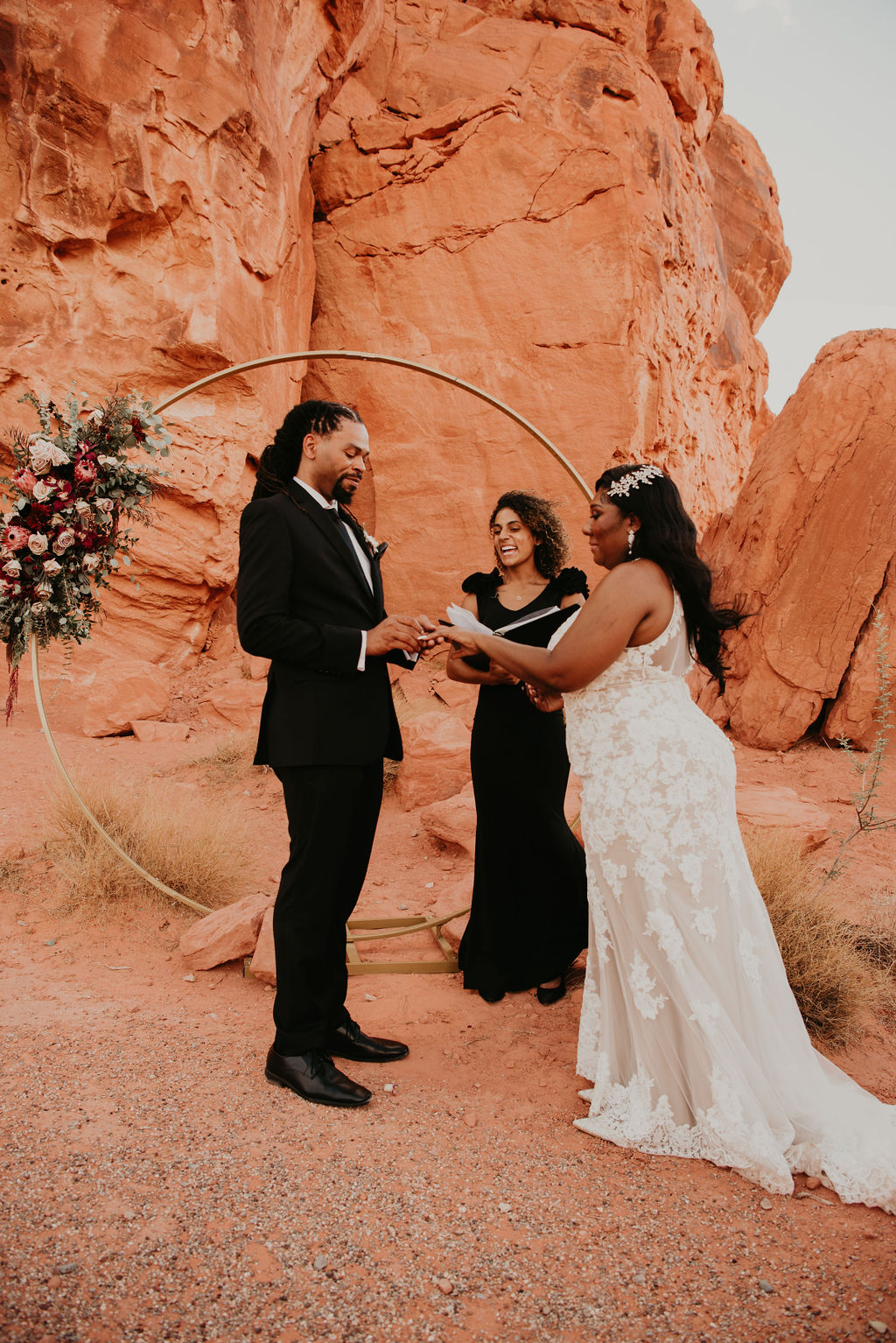 Groom putting Ring of Bride During Elopement Ceremony in Las Vegas 
