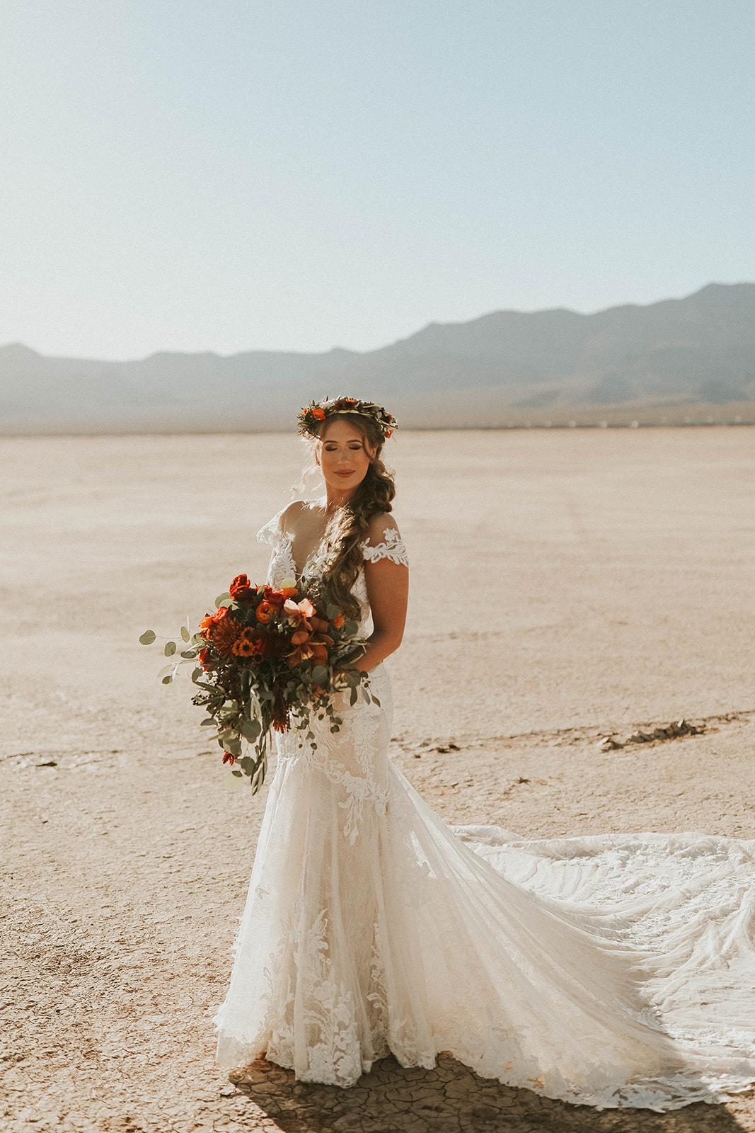 Bride with Floral Crown & Holding Bouquet in Dry Lake Bed Fall Inspired Elopement 