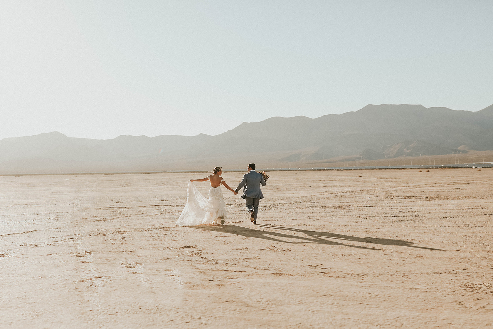 Bride and Groom Running on Dry Lake Bed after Getting Eloped in Las Vegas 