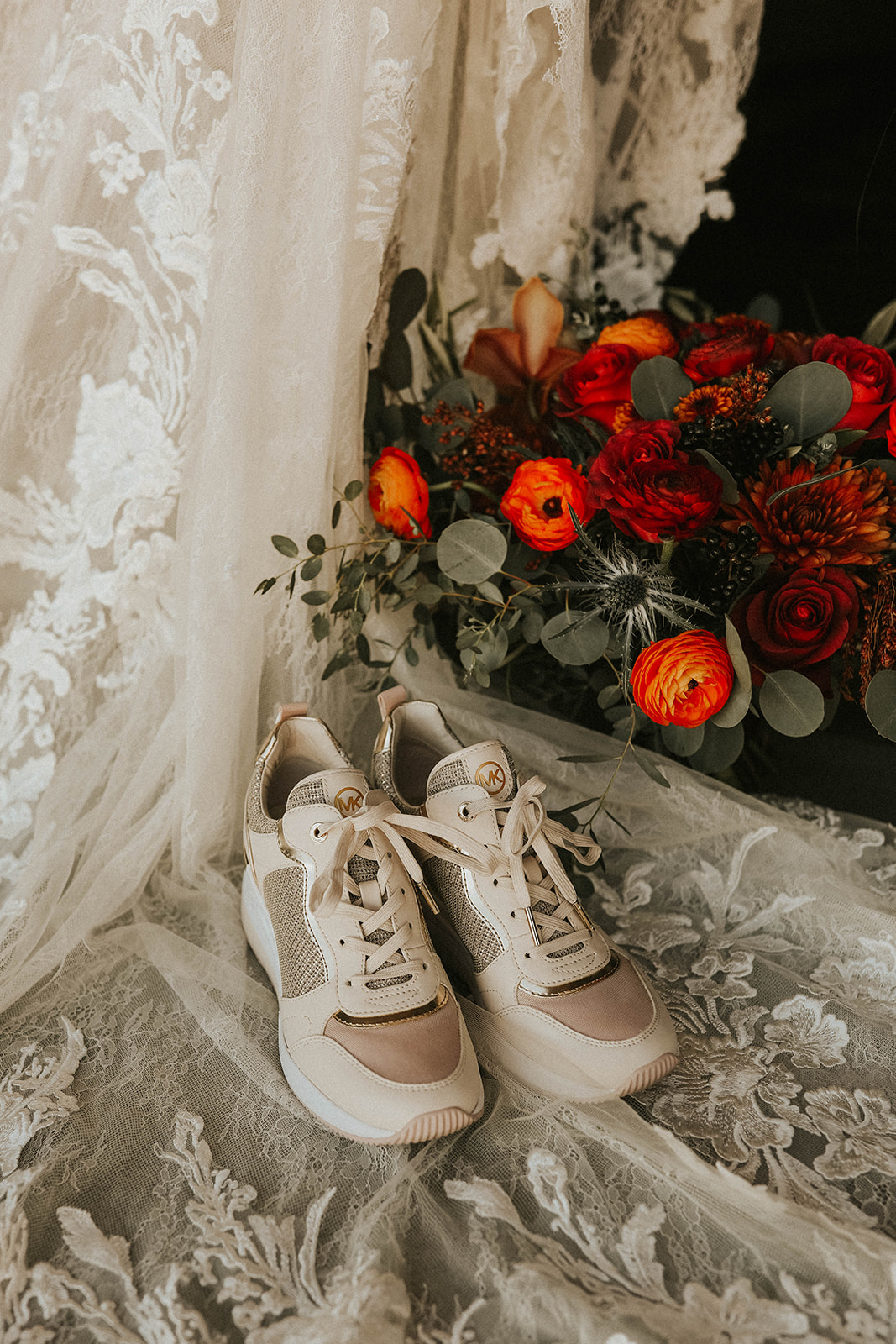 Bottom of Bride's Dress, Bouquet & Michael Kors Sneakers in Dry Lake Bed Fall Inspired Elopement 