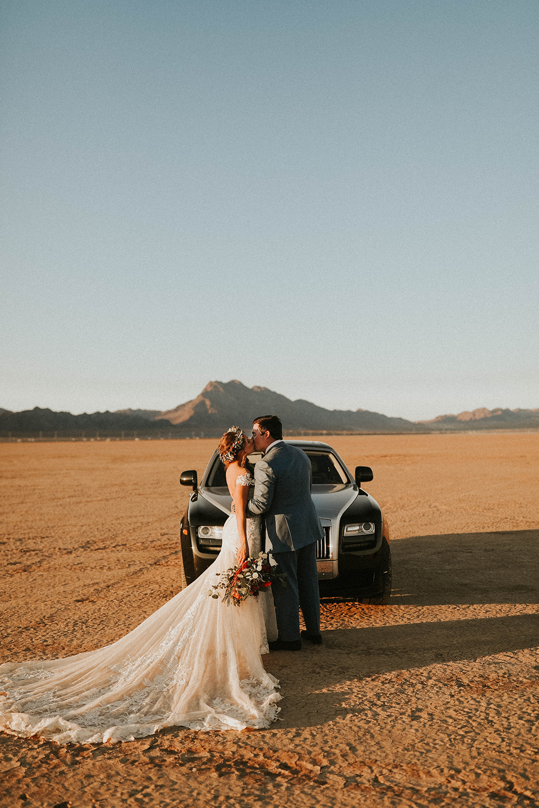 Groom & Bride with Bridal Gown Train at Dry Lake Bed with Rolls Royce 