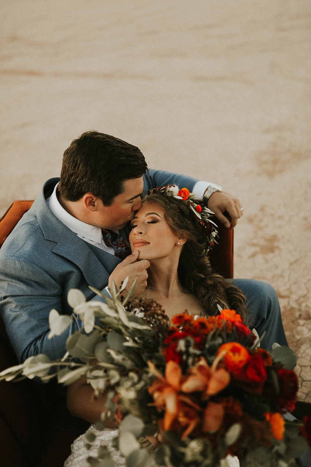 Couple on Velvet Couch during Sunset in Dry Lake Bed Fall Inspired Elopement in Las Vegas