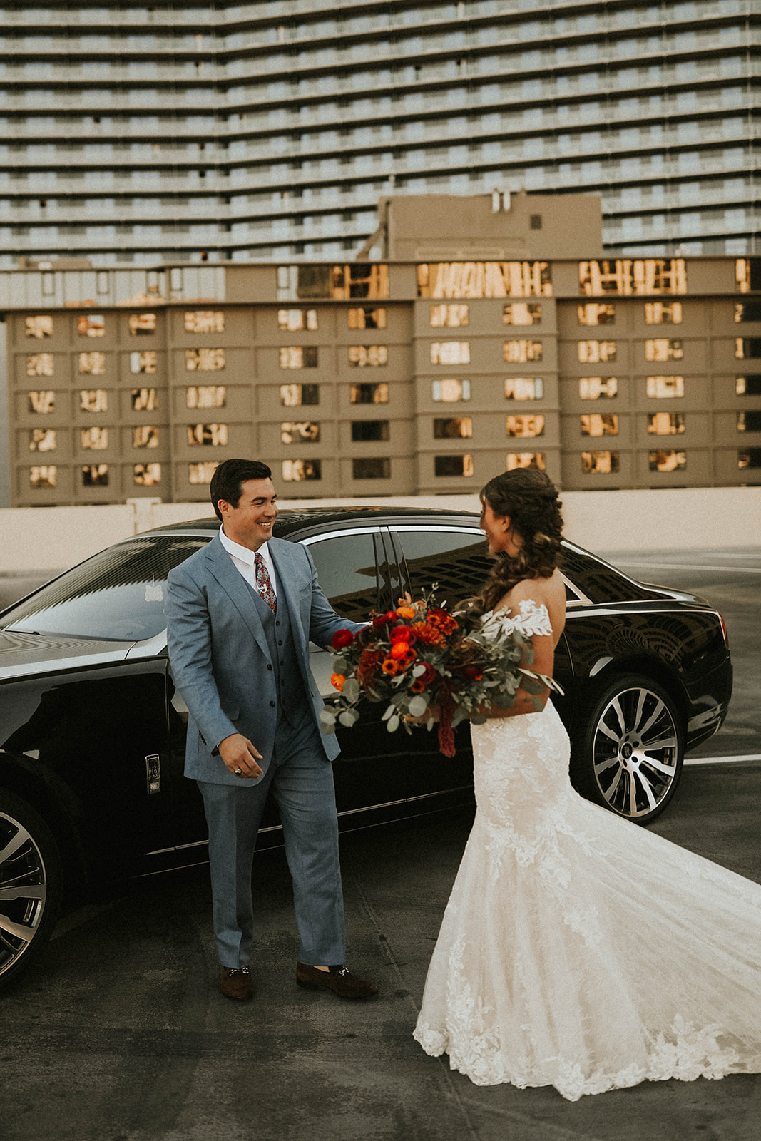 Groom seeing bride for first time in front of Rolls Royce in Las Vegas 