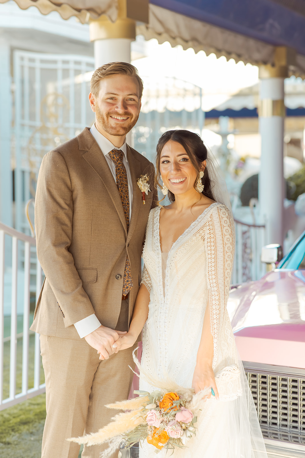 Bride in detailed lace boho dress with Groom Smiling after getting married in Las Vegas 