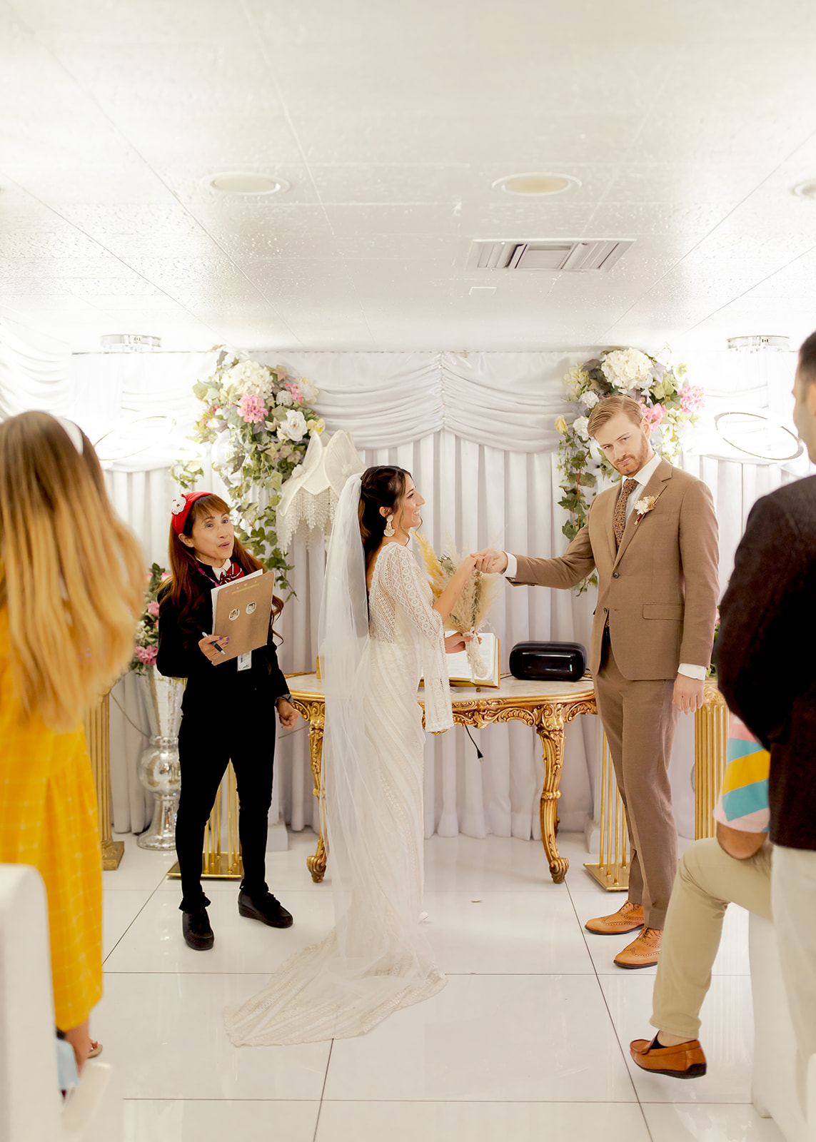 Bride arrives at altar to get married at A Little White Chapel 