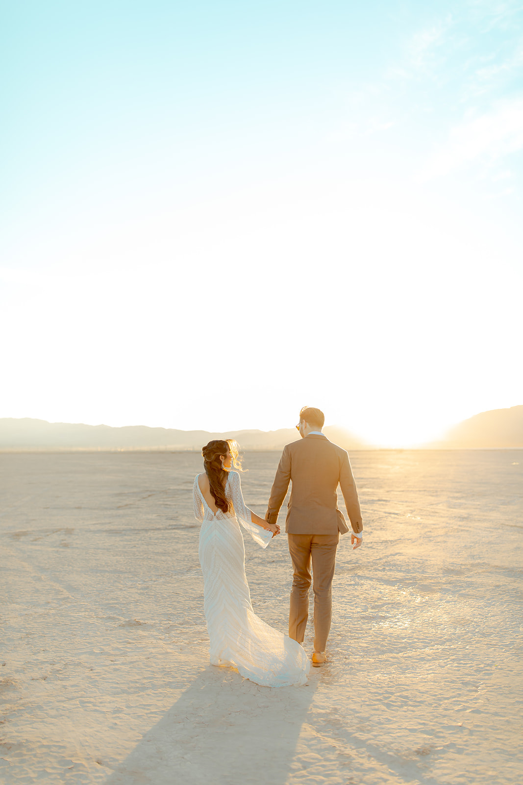 Bride and Groom walking into the sunset 