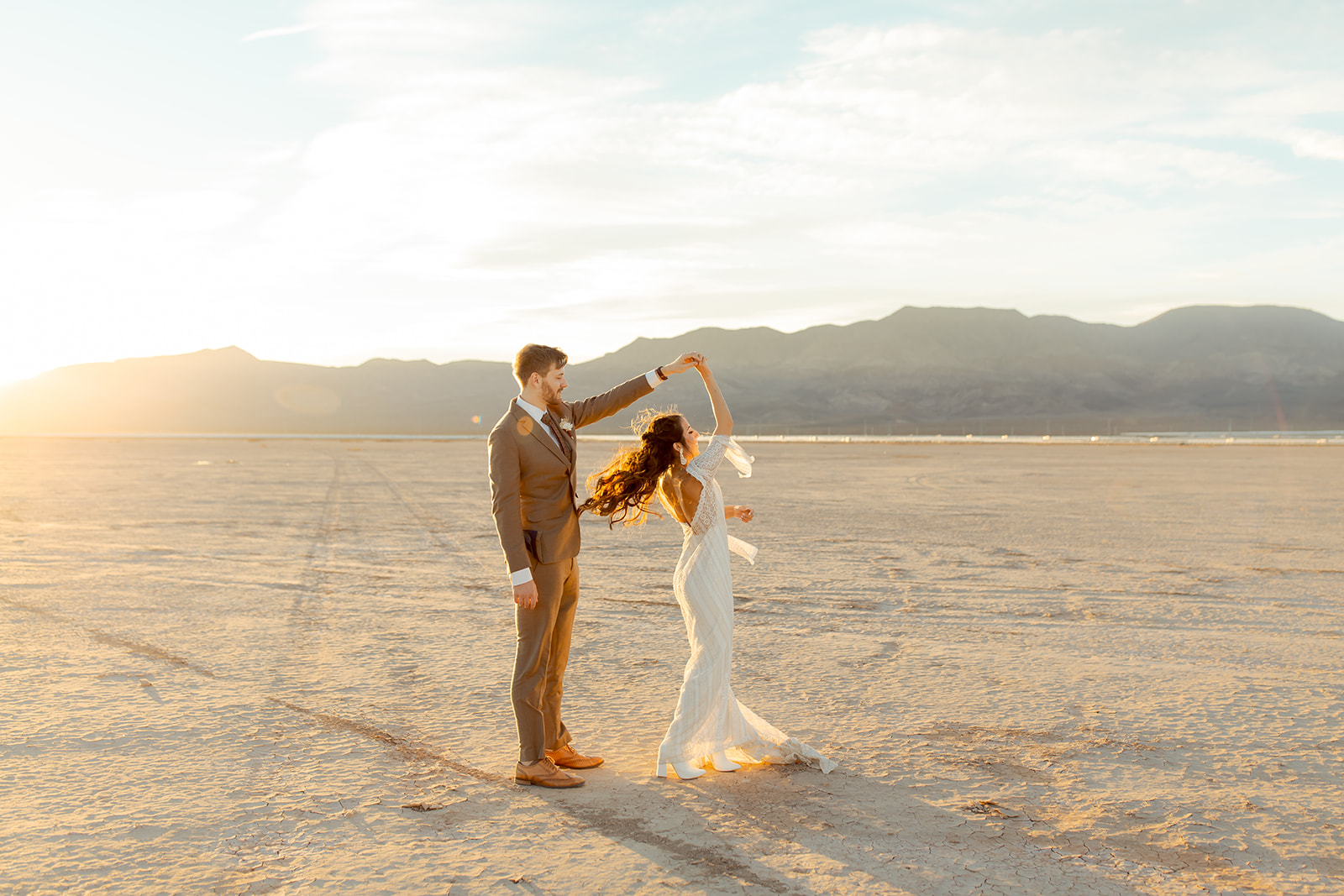 Newlyweds dancing in the Las Vegas desert during sunset 