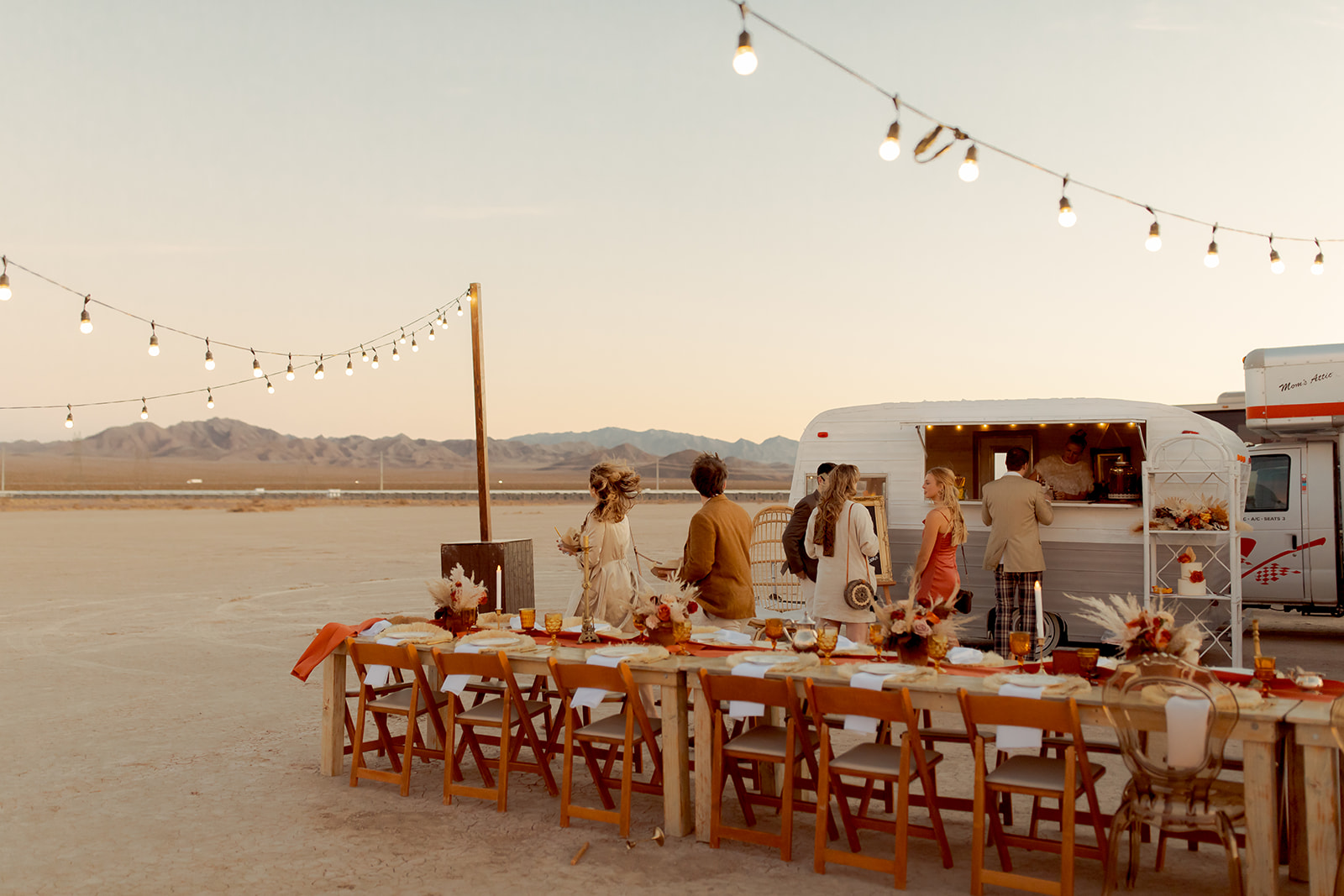 Guests getting drinks at Dry Lake Bed Micro-Wedding