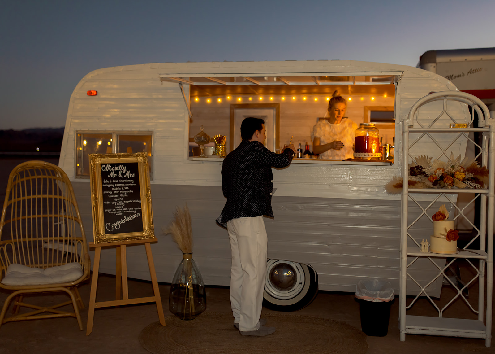 Guest getting drink at mobile bar in desert 