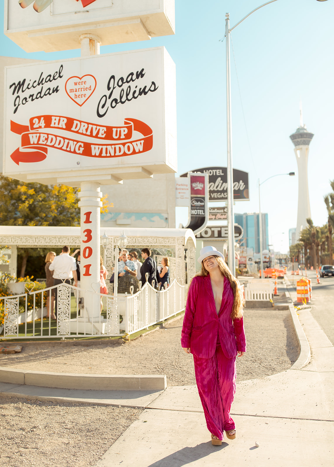Maid of Honor in velvet hot pink suit  in Las Vegas 70's themed wedding 