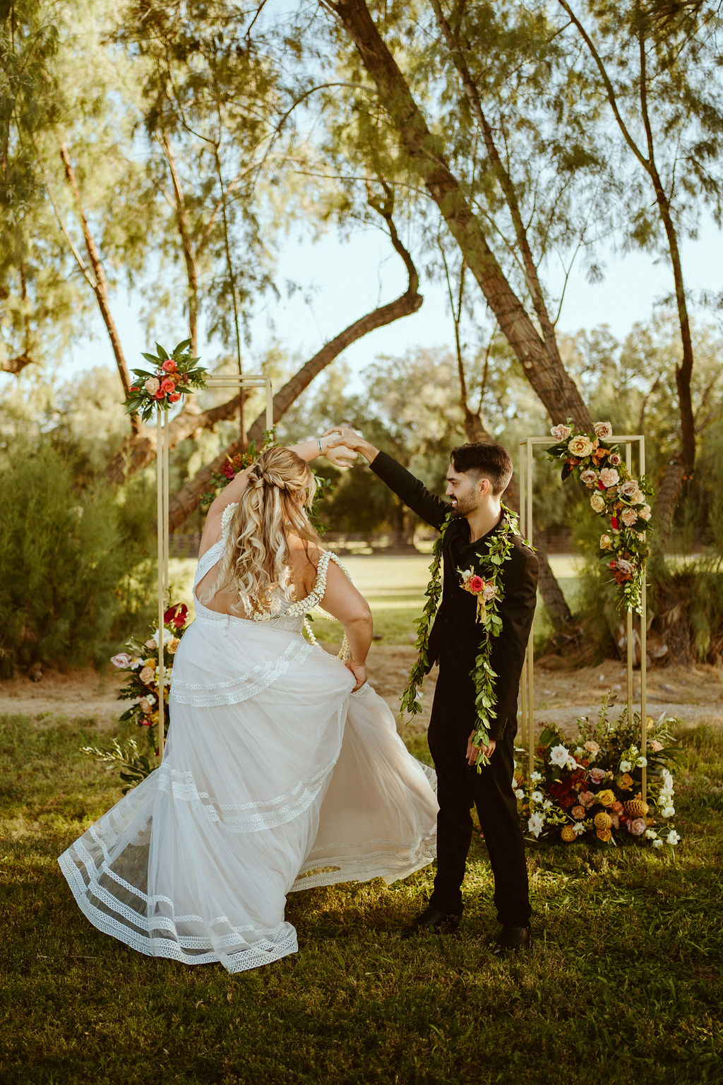 Newlyweds Dancing at Ceremony Altar after GreenGale Farms Hawaiian Elopement