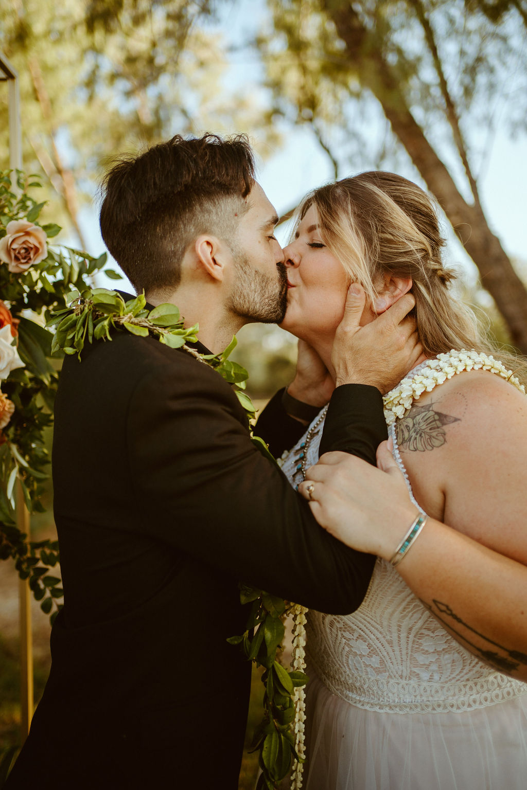 Newlyweds Kissing after GreenGale Farms Hawaiian Elopement