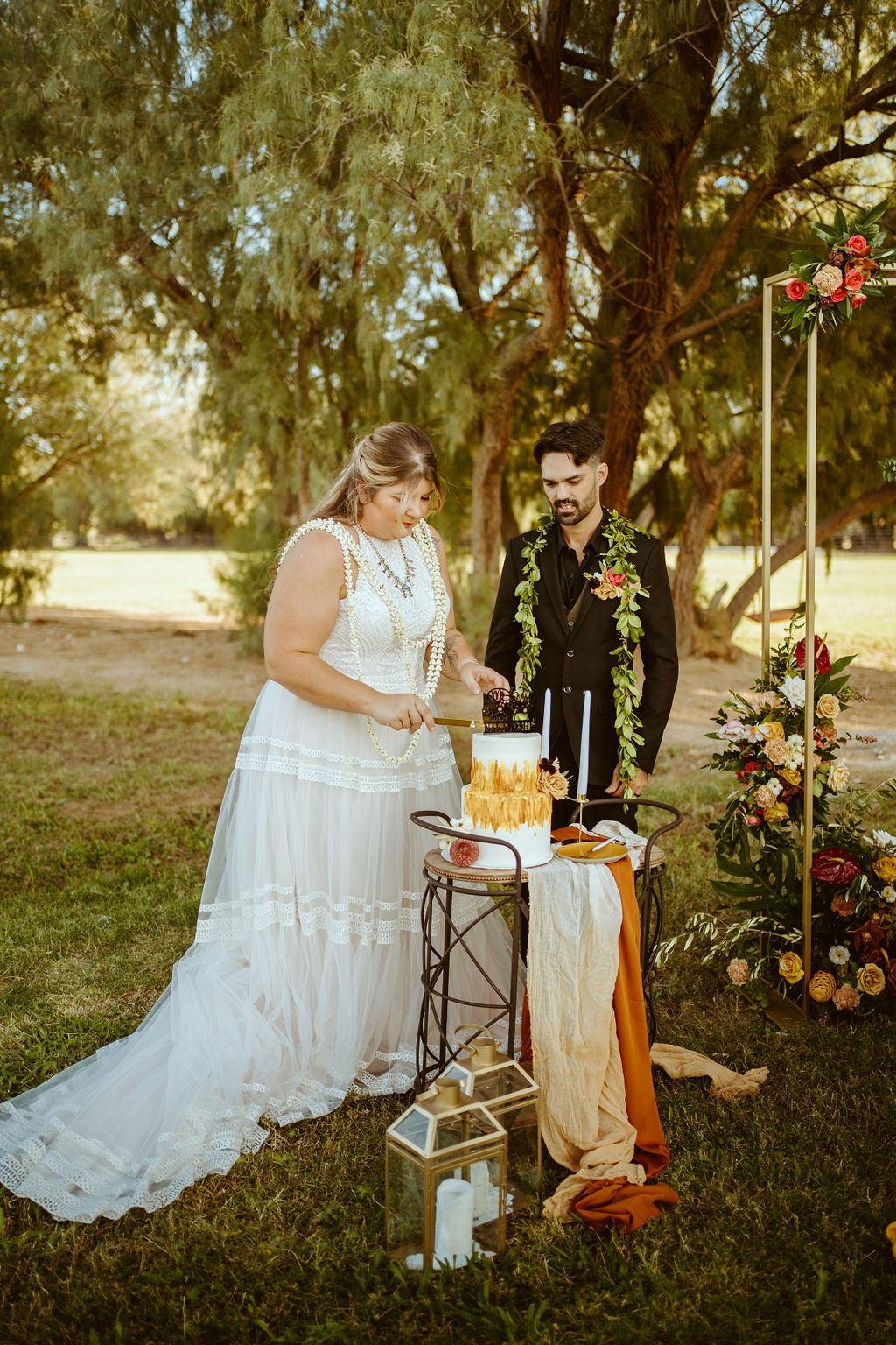 Couple Cutting Two-Tier Mustard Yellow and White Elopement Cake after GreenGale Farms Hawaiian Elopement