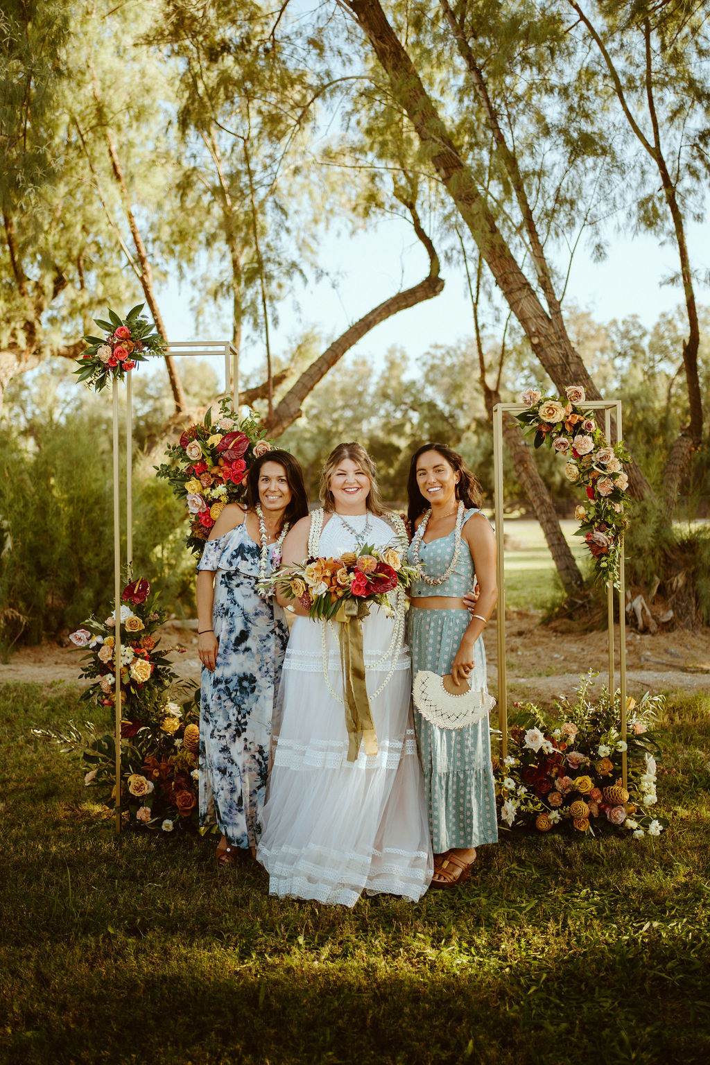Photos with Loved Ones in front of Gold Stand Altar After GreenGale Farms Hawaiian Elopement in Las Vegas 