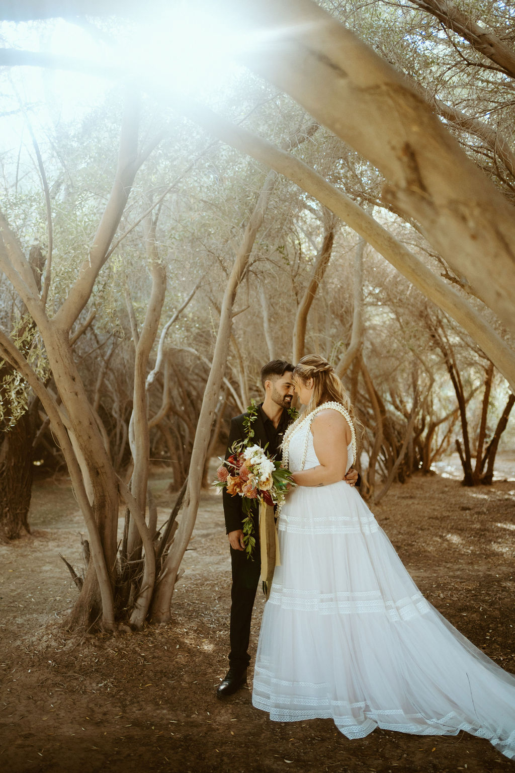 Couple in Olive Grove after First look during GreenGale Farms Hawaiian Elopement