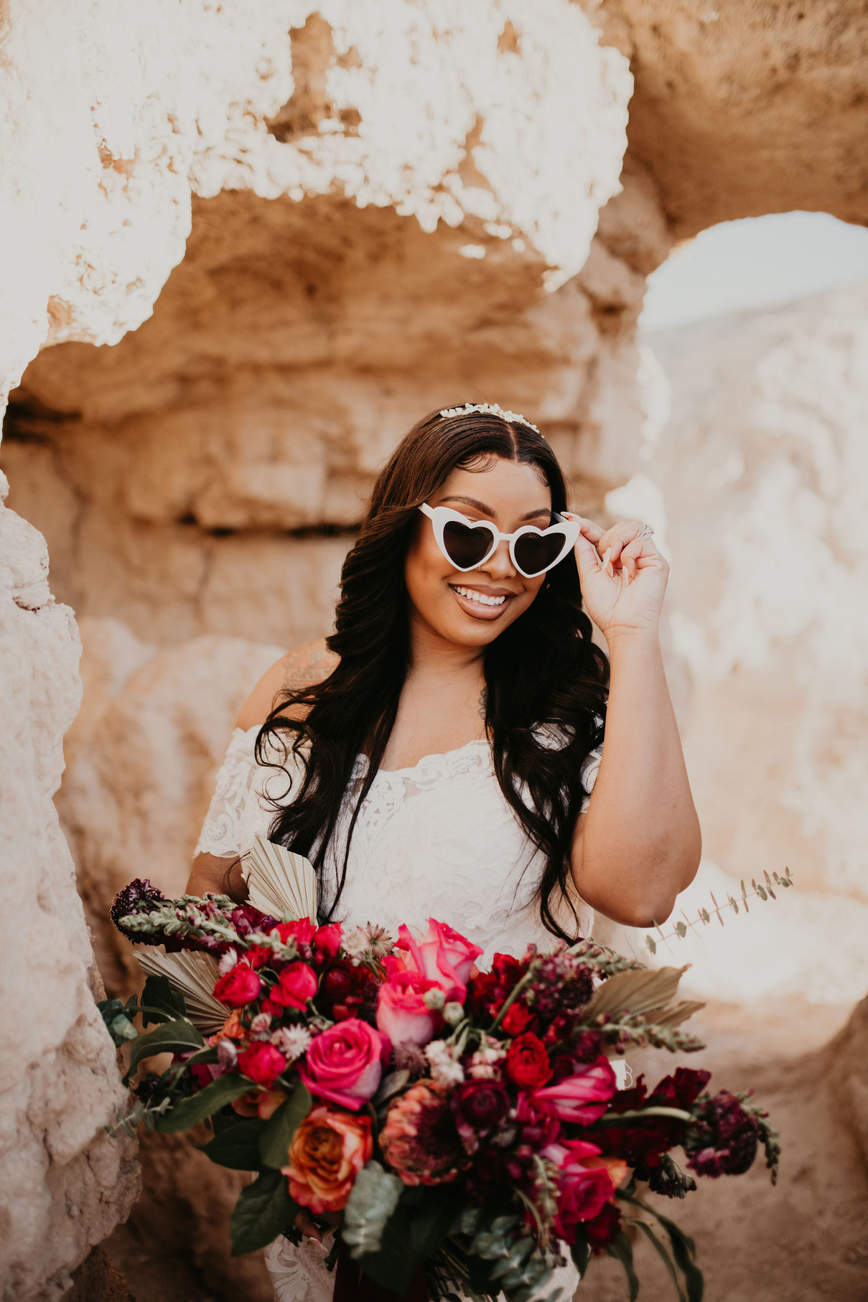 Bride Wearing White Heart Shaped Sunglasses and Holding Bouquet 
