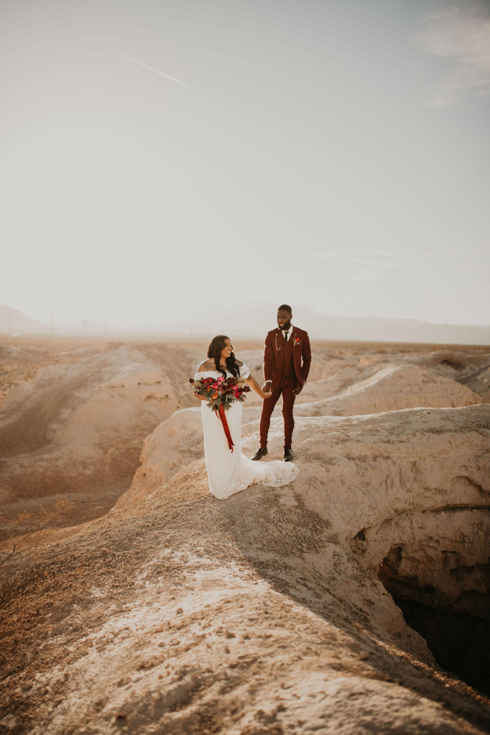 Bride and Groom Adventuring in Desert Together in Jewel Tone Las Vegas Elopement