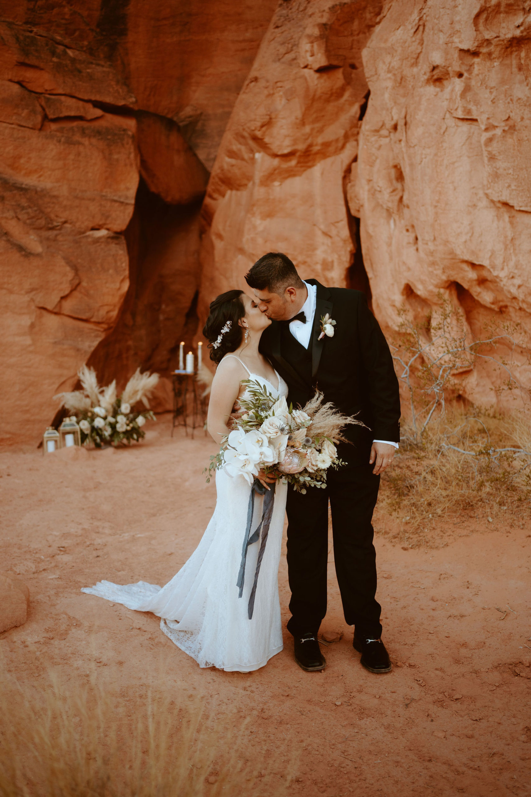 Newlyweds Kissing under Dramatic Red Rocks Just Outside of Las Vegas 
